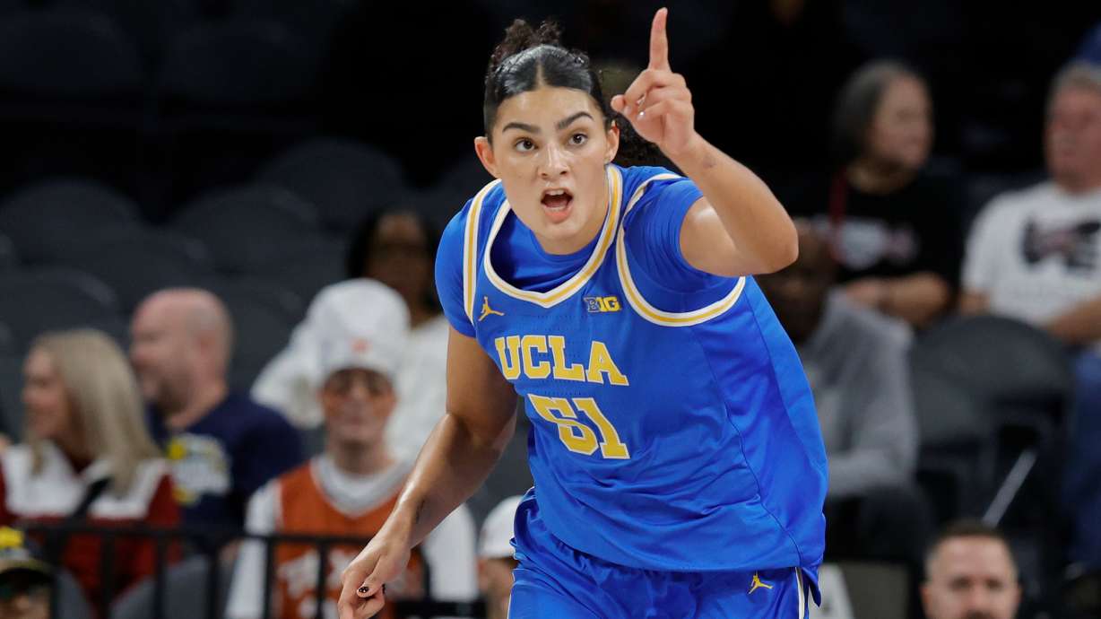 UCLA center Lauren Betts (51) reacts after making a basket against Texas during the first half of an NCAA college basketball game in the Players Era tournament Wednesday, Nov. 26, 2025, in Las Vegas.