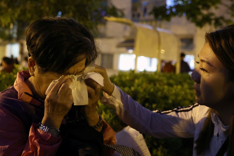 'Just silence': Families mourn elderly loved ones after Hong Kong inferno