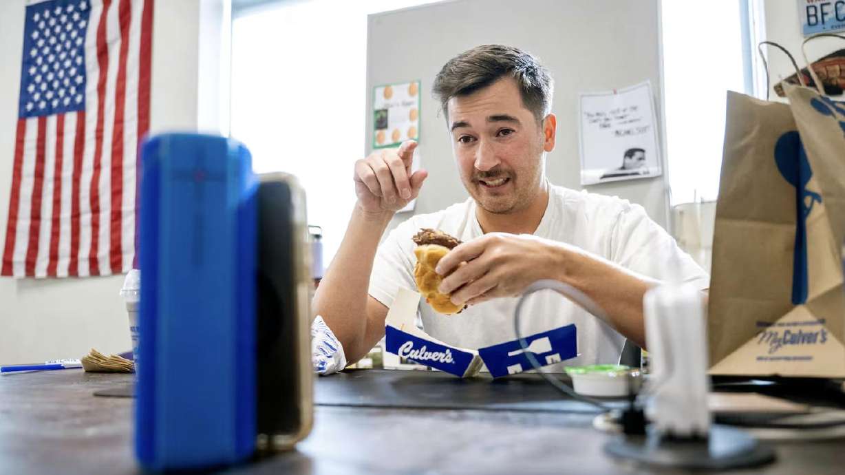 Lehi High School social studies teacher Joey Hall records a video while on a lunch break at school in Lehi on Nov. 18. Hall has amassed 2.2 million followers on TikTok doing food reviews.