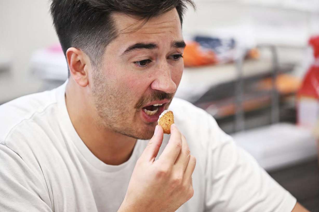 Lehi High School social studies teacher Joey Hall records a video while on a lunch break at school in Lehi on Nov. 18. Hall has amassed 2.2 million followers on TikTok doing food reviews.