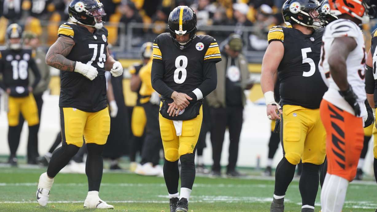 Pittsburgh Steelers quarterback Aaron Rodgers (8) holds his arm after a hit by the Cincinnati Bengals during the first half of an NFL football game Sunday, Nov. 16, 2025, in Pittsburgh.