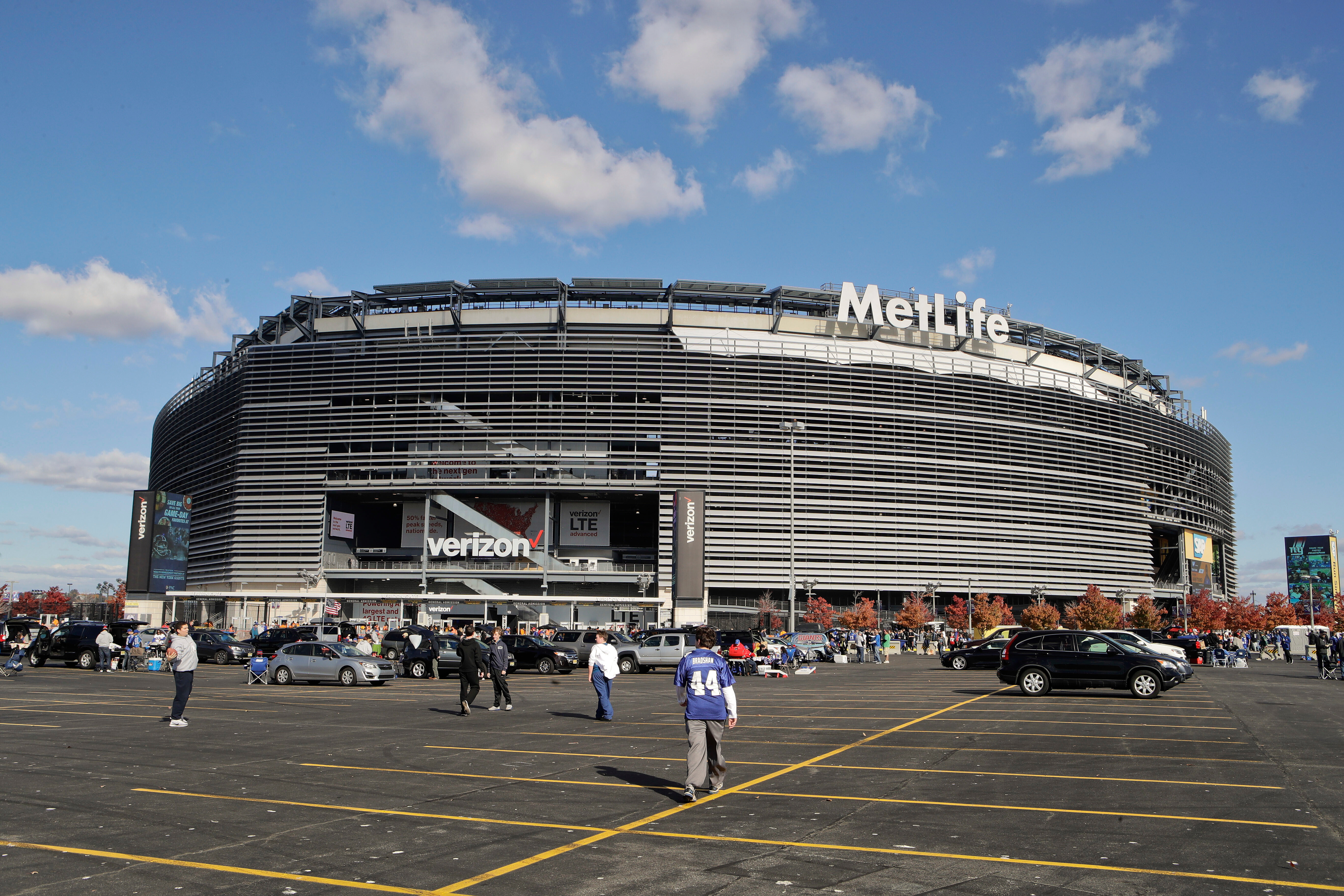 FILE - Tailgaters gather outside MetLife Stadium before an NFL football game between the New York Giants and the Philadelphia Eagles, Sunday, Nov. 6, 2016, in East Rutherford, N.J. 