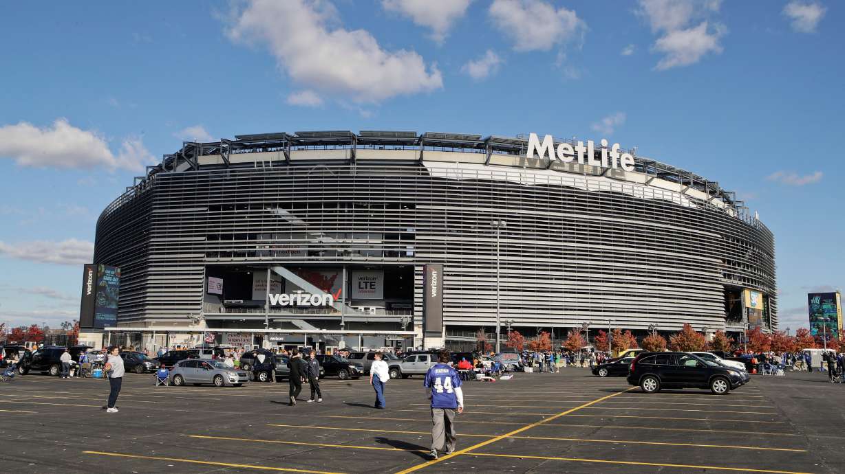 FILE - Tailgaters gather outside MetLife Stadium before an NFL football game between the New York Giants and the Philadelphia Eagles, Sunday, Nov. 6, 2016, in East Rutherford, N.J.