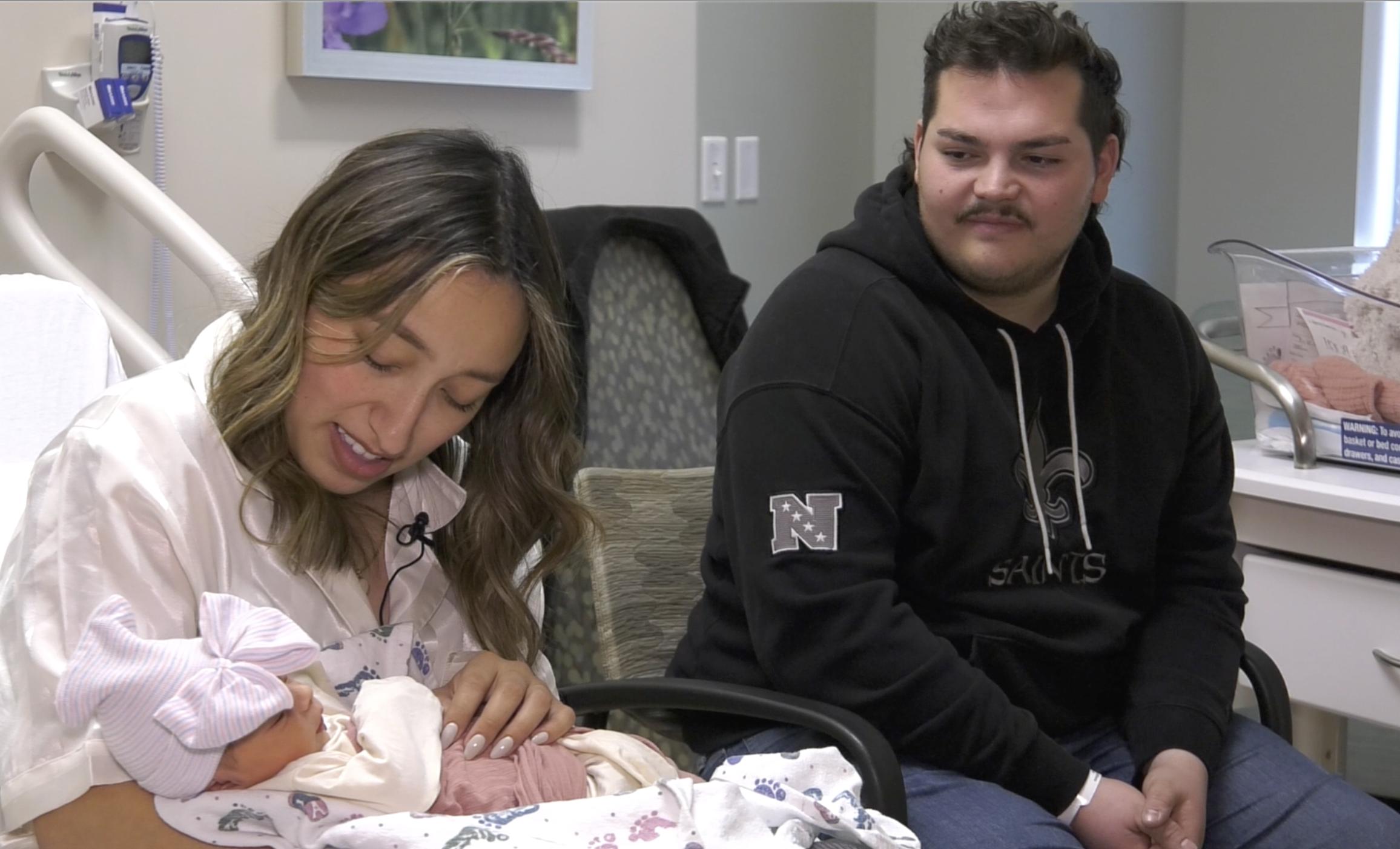 Vannessa and Dax Lowe shown with their newborn daughter Luna Grace on Friday. The couple gave birth on the I-15 freeway in Murray Thanksgiving evening.