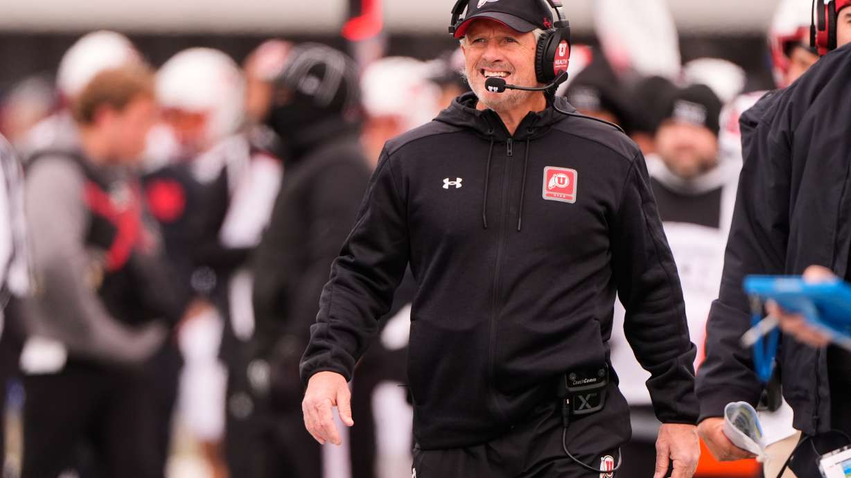 Utah head coach Kyle Whittingham watches during the first half of an NCAA college football game against Kansas, Friday, Nov. 28, 2025, in Lawrence, Kan.