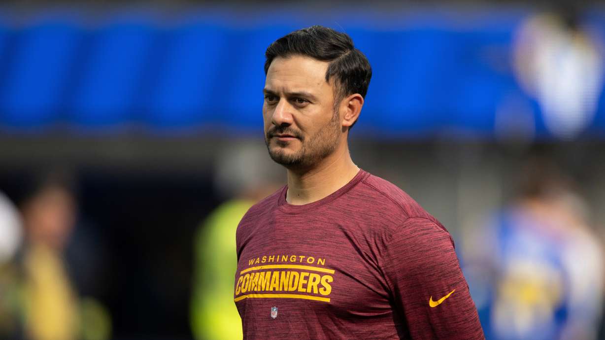 FILE - Washington Commanders quarterbacks coach Tavita Pritchard watches his players before an NFL football game against the Los Angeles Rams, Dec. 17, 2023, in Inglewood, Calif.