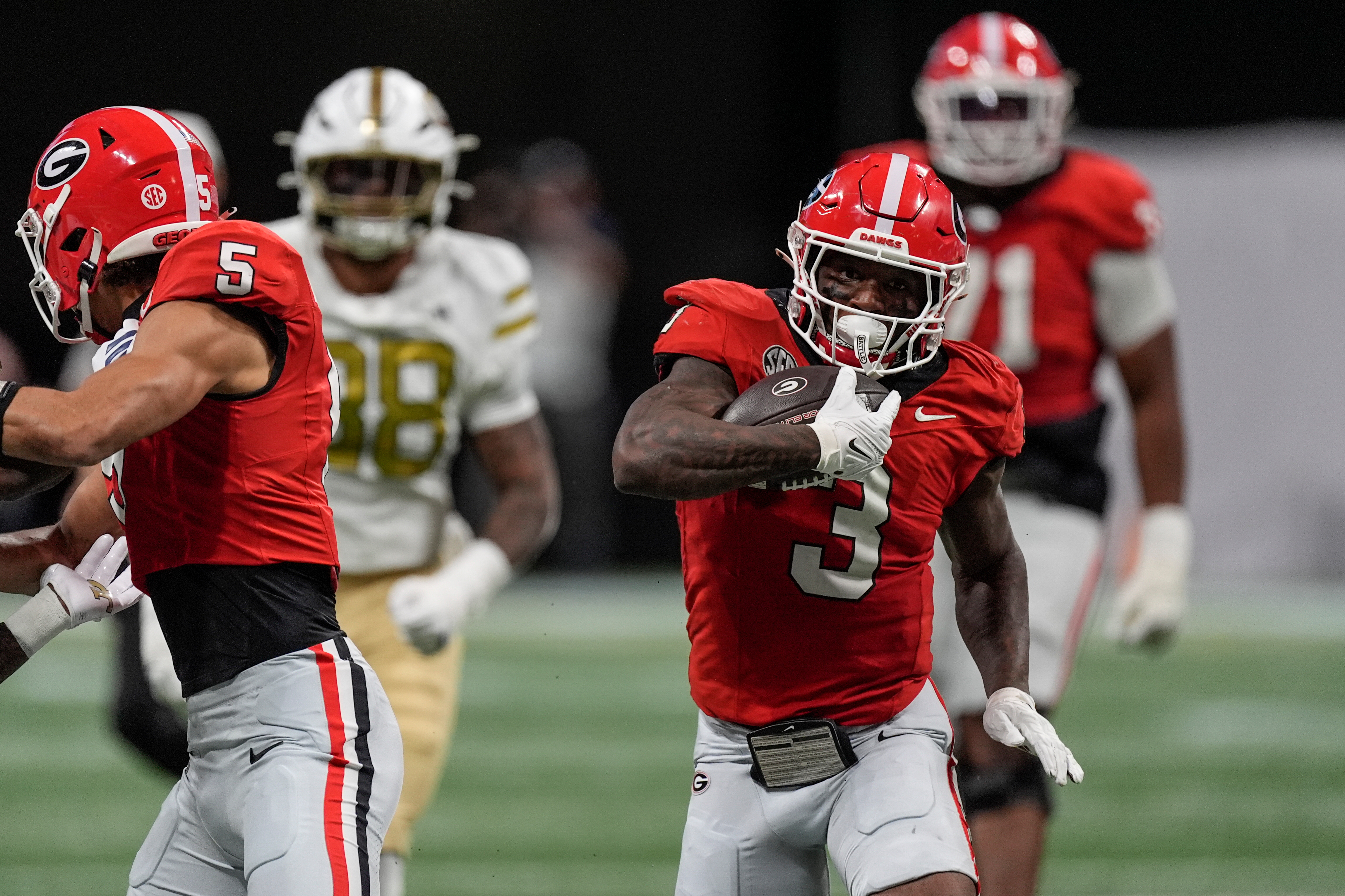 Georgia running back Nate Frazier (3) runs against Georgia Tech during the first half of an NCAA college football game, Friday, Nov. 28, 2025, in Atlanta.