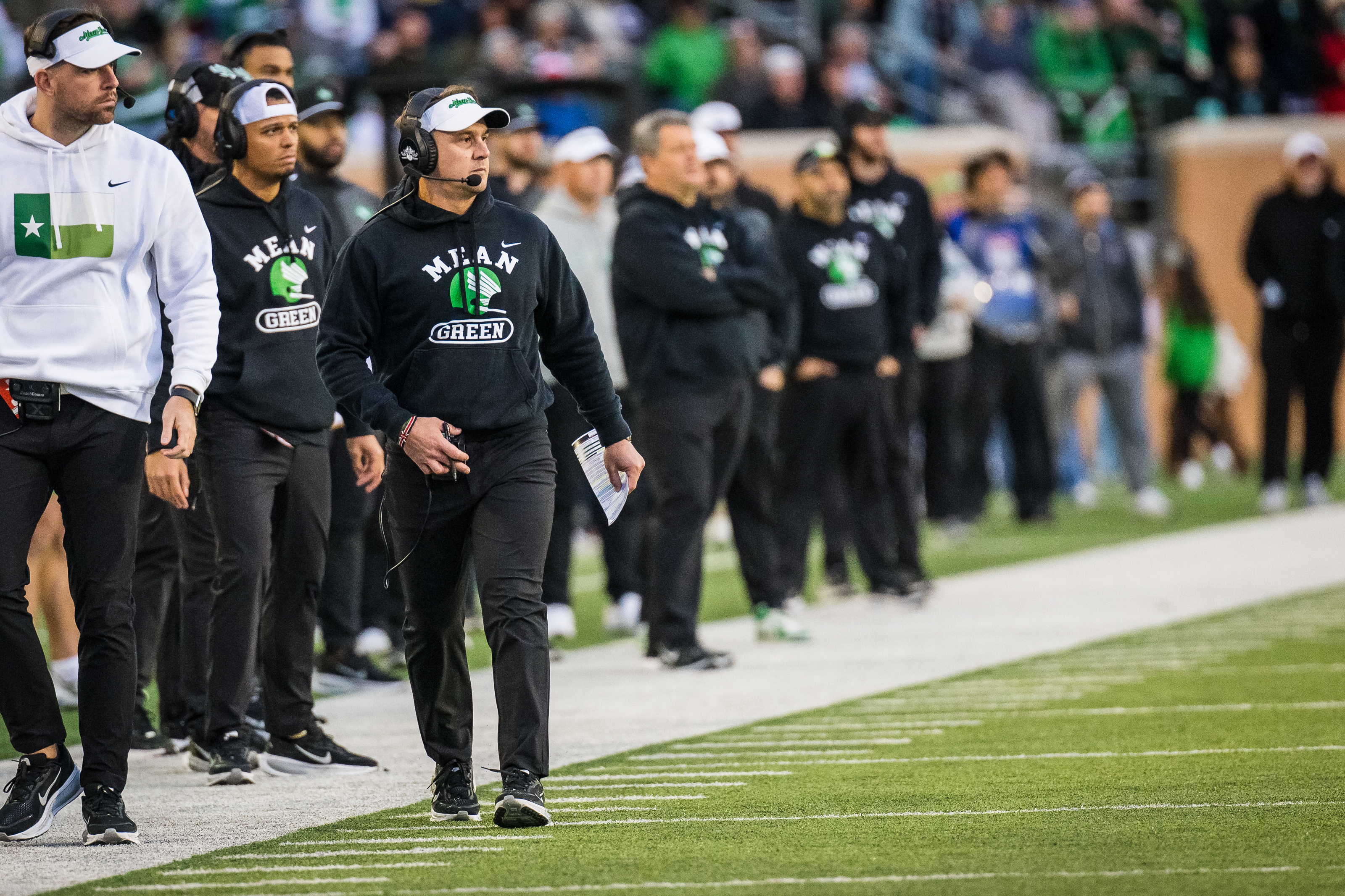North Texas head coach Eric Morris, front right, walks the sideline during an NCAA college football game against Temple, Friday, Nov. 28, 2025, Denton, Texas. 