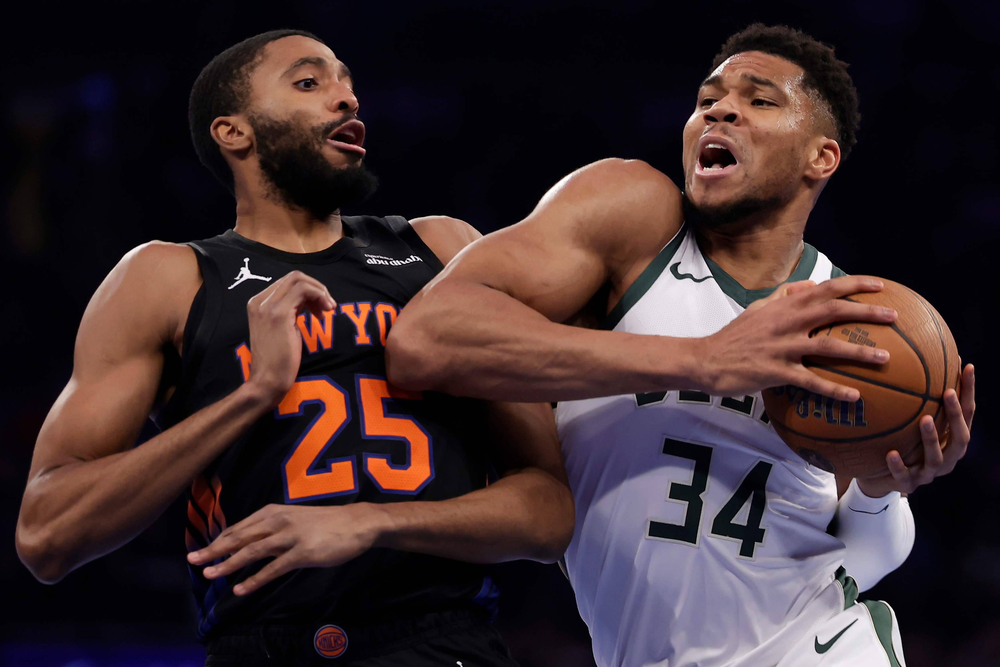 Milwaukee Bucks forward Giannis Antetokounmpo (34) drives past New York Knicks guard Mikal Bridges (25) during the first half of an NBA Cup basketball game Friday, Nov. 28, 2025, in New York.