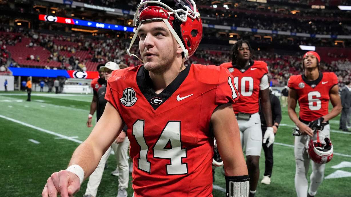 Georgia quarterback Gunner Stockton (14) walks off the field after an NCAA college football game against Georgia Tech, Friday, Nov. 28, 2025, in Atlanta.