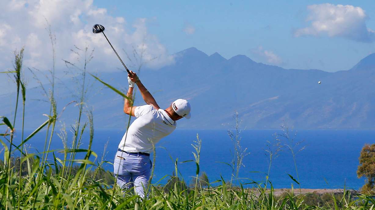 FILE - Justin Thomas hits from the seventh tee during the first round of the Tournament of Champions golf tournament at Kapalua Plantation Course on Kapalua, Hawaii, Jan. 7, 2016.
