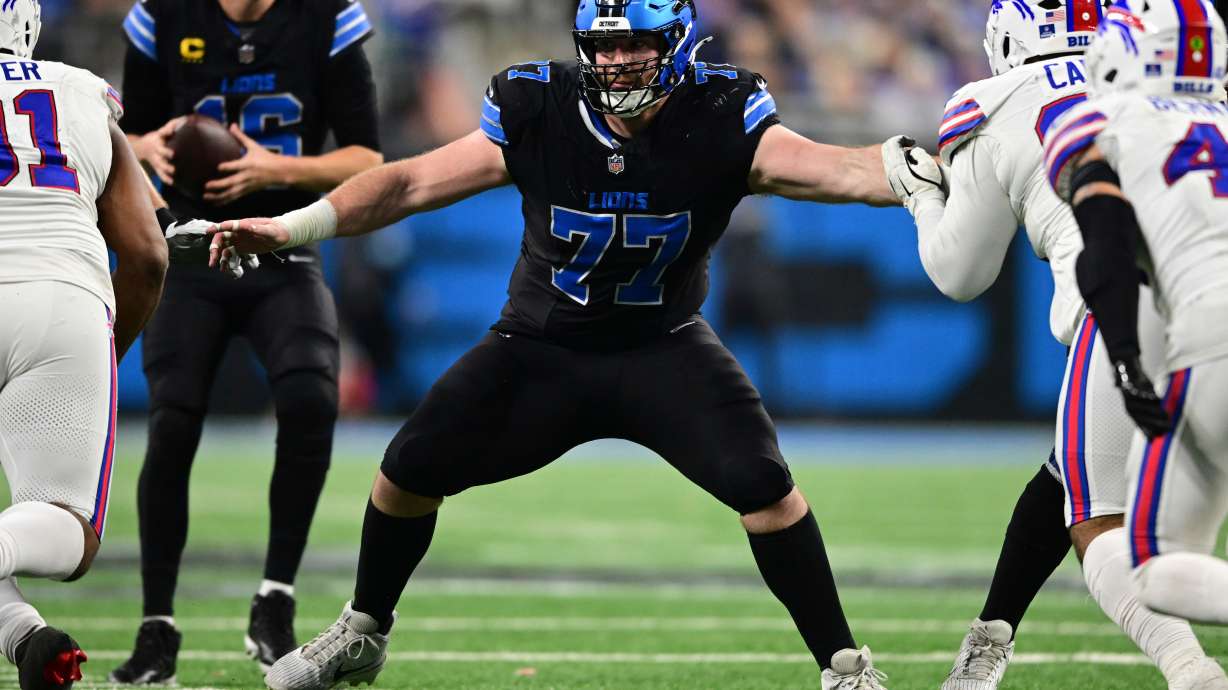 FILE - Detroit Lions center Frank Ragnow looks to block during the second half of an NFL football game against the Buffalo Bills in Detroit, Dec. 15, 2024.