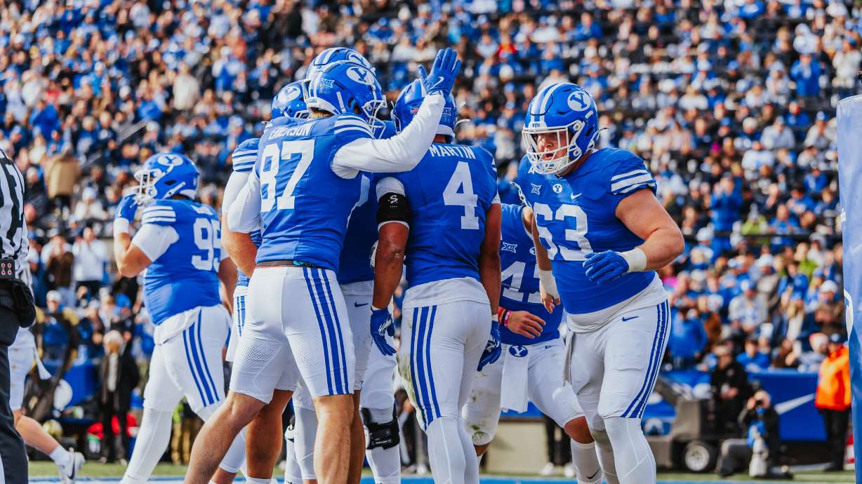 BYU celebrates one of LJ Martin's two first-half touchdowns during a Big 12 football game against UCF, Saturday, Nov. 29, 2025 at LaVell Edwards Stadium in Provo, Utah.