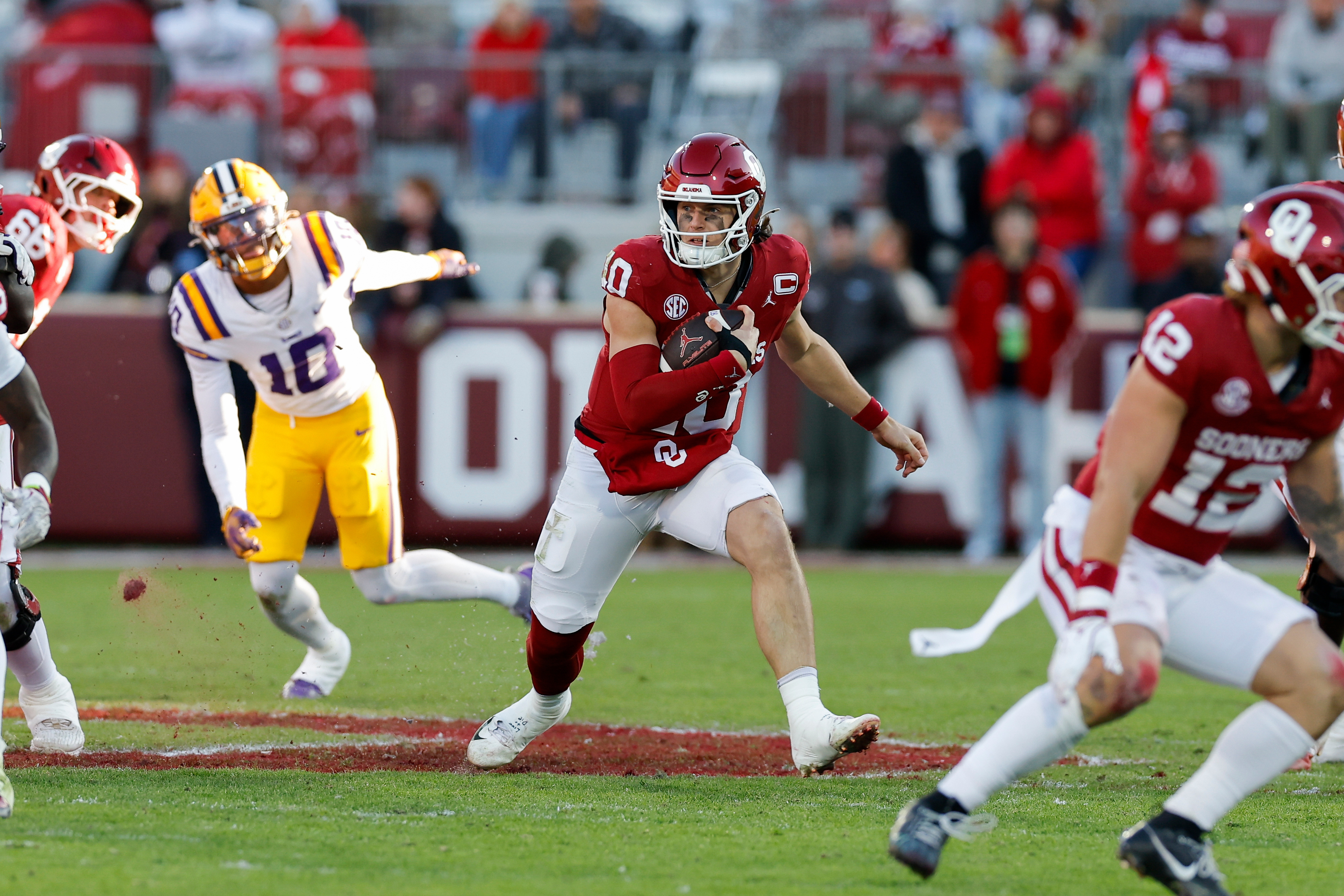 Oklahoma quarterback John Mateer (10) runs the ball against LSU during the first half of an NCAA college football game Saturday, Nov. 29, 2025, in Norman, Okla. 