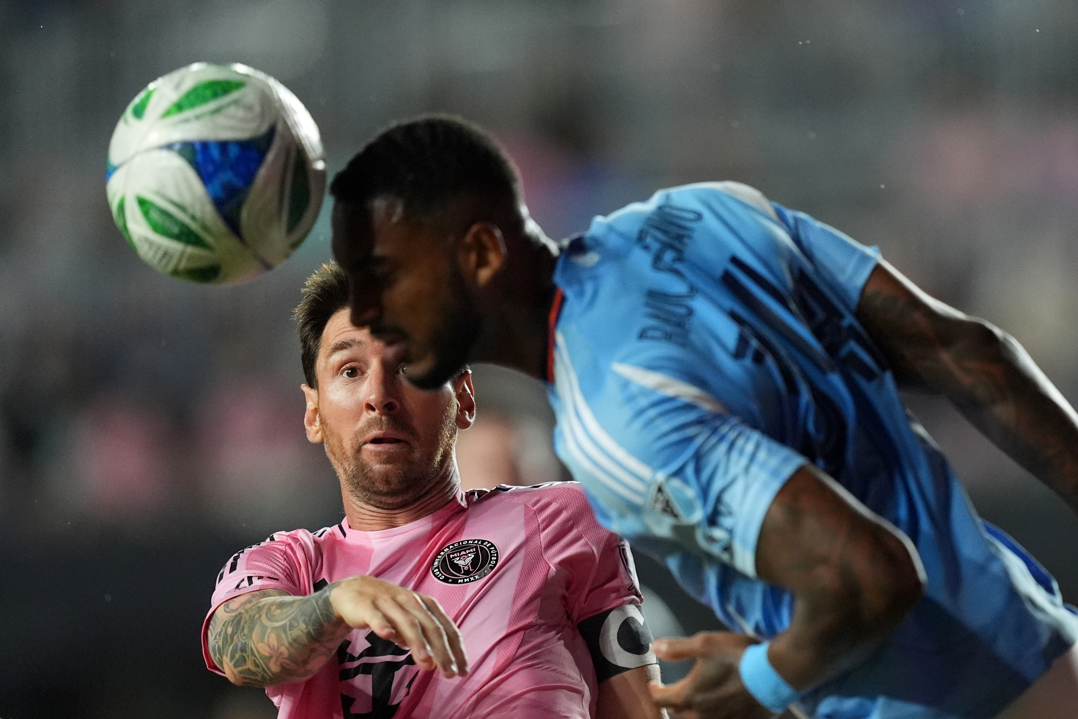 Inter Miami forward Lionel Messi (10) gets beat out for a header by New York City FC defender Raul Gustavo during the first half of an MLS Eastern Conference final soccer match, Saturday, Nov. 29, 2025, in Fort Lauderdale, Fla.