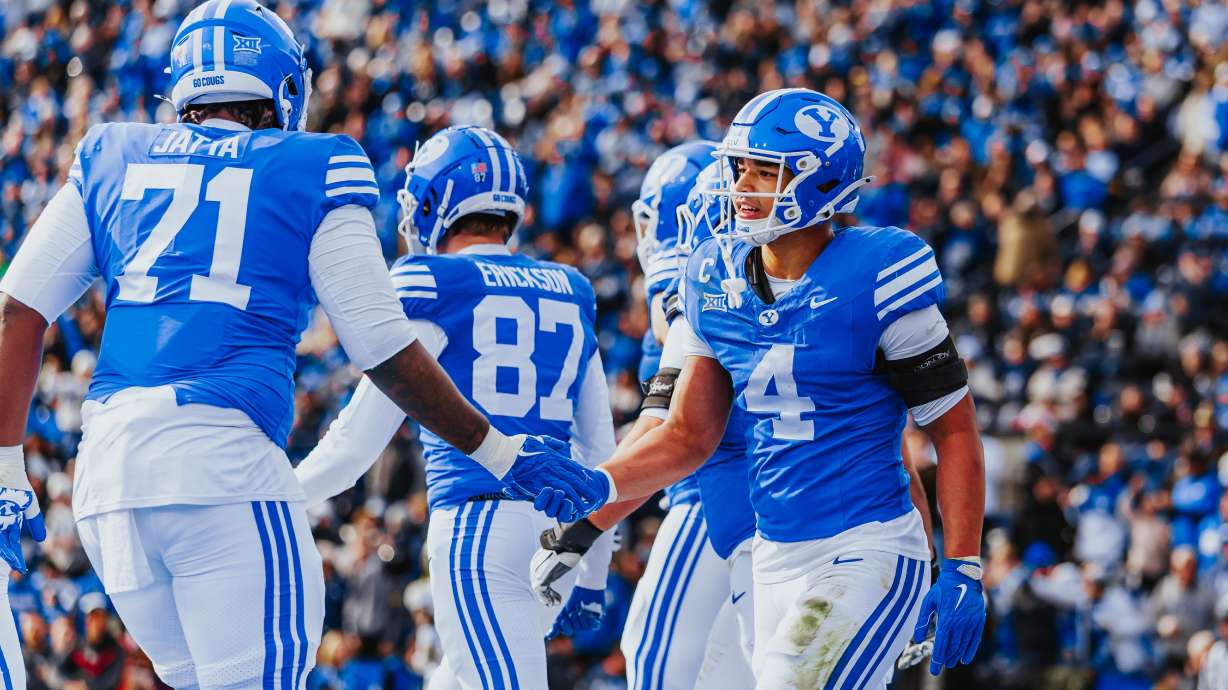 BYU's LJ Martin (40 celebrates a touchdown with teammate Isaiah Jatta during a Big 12 football game against UCF, Saturday, Nov. 29, 2025 at LaVell Edwards Stadium in Provo, Utah.