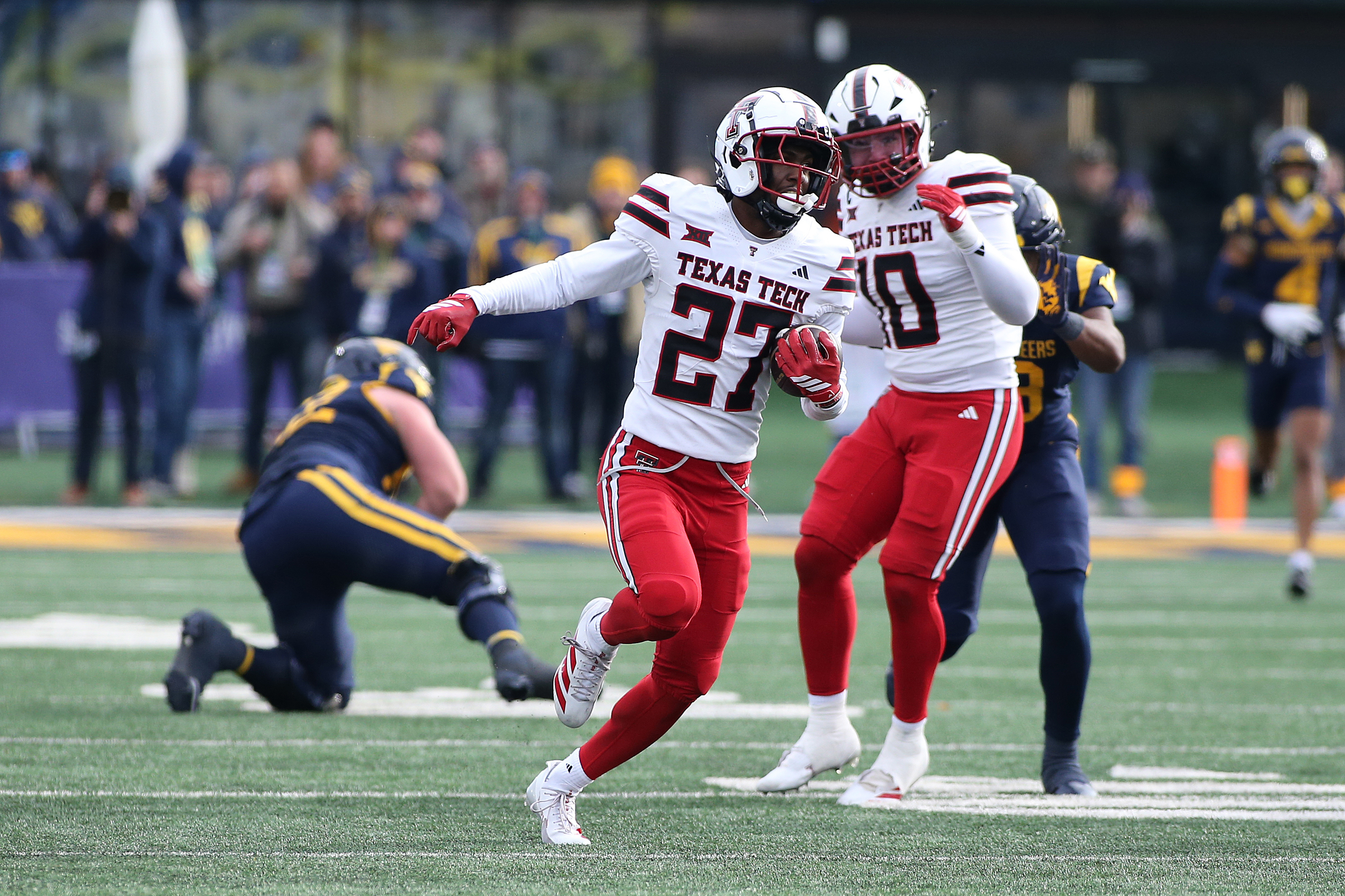 Texas Tech cornerback Amier Boyd (27) intercepts the ball against West Virginia during the second half of an NCAA college football game Saturday, Nov. 29, 2025, in Morgantown, W.Va. 