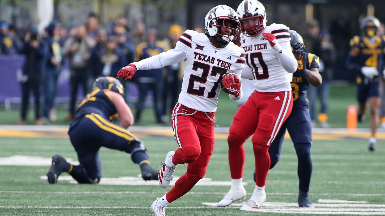 Texas Tech cornerback Amier Boyd (27) intercepts the ball against West Virginia during the second half of an NCAA college football game Saturday, Nov. 29, 2025, in Morgantown, W.Va.