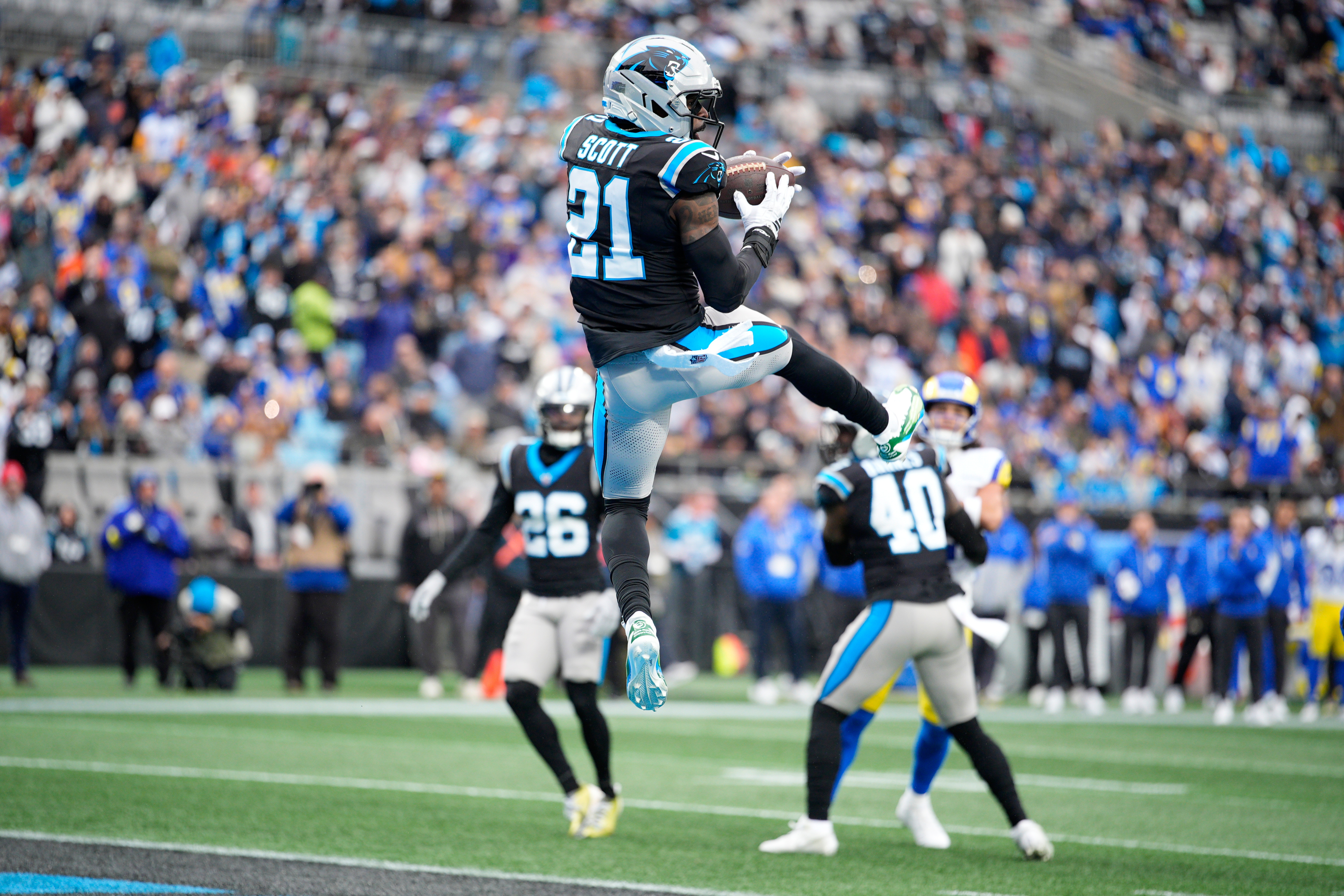 Carolina Panthers safety Nick Scott intercepts of pass against the Los Angeles Rams during the first half of an NFL football game, Sunday, Nov. 30, 2025, in Charlotte, N.C. 