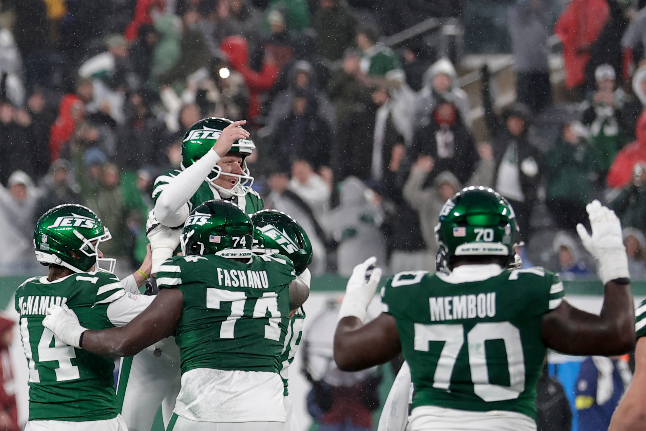 New York Jets place kicker Nick Folk (6) celebrates with teammates after he kicked the game-winning field goal against the Atlanta Falcons during the second half of an NFL football game, Sunday, Nov. 30, 2025, in East Rutherford, N.J. 