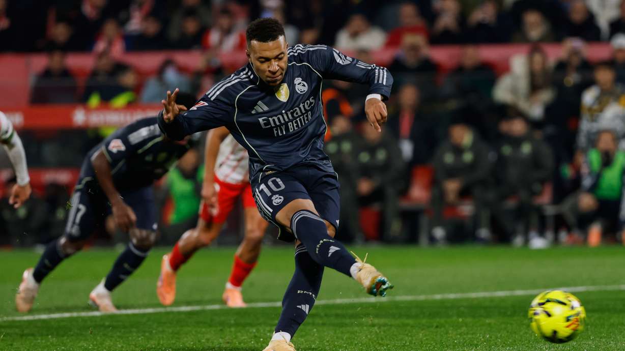Real Madrid's Kylian Mbappe scores a penalty kick during a Spanish La Liga soccer match between Girona and Real Madrid, in Girona, Spain, Sunday, Nov. 30, 2025.