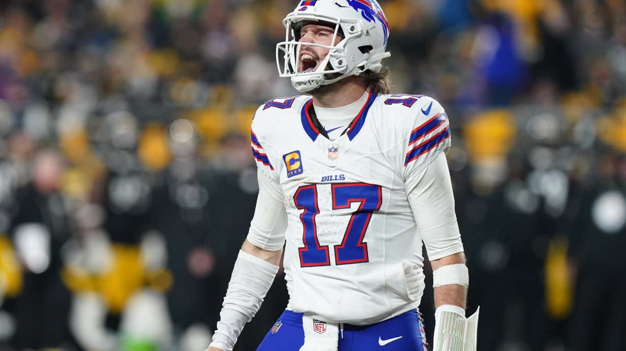 Buffalo Bills quarterback Josh Allen (17) celebrates after a touchdown during the second half of an NFL football game against the Pittsburgh Steelers Sunday, Nov. 30, 2025, in Pittsburgh.