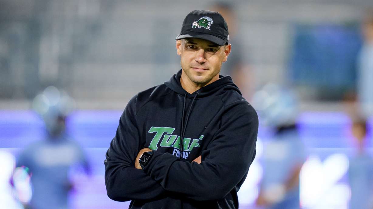 Tulane head coach Jon Sumrall watches his players before an NCAA college football game against Charlotte in New Orleans, Saturday, Nov. 29, 2025.