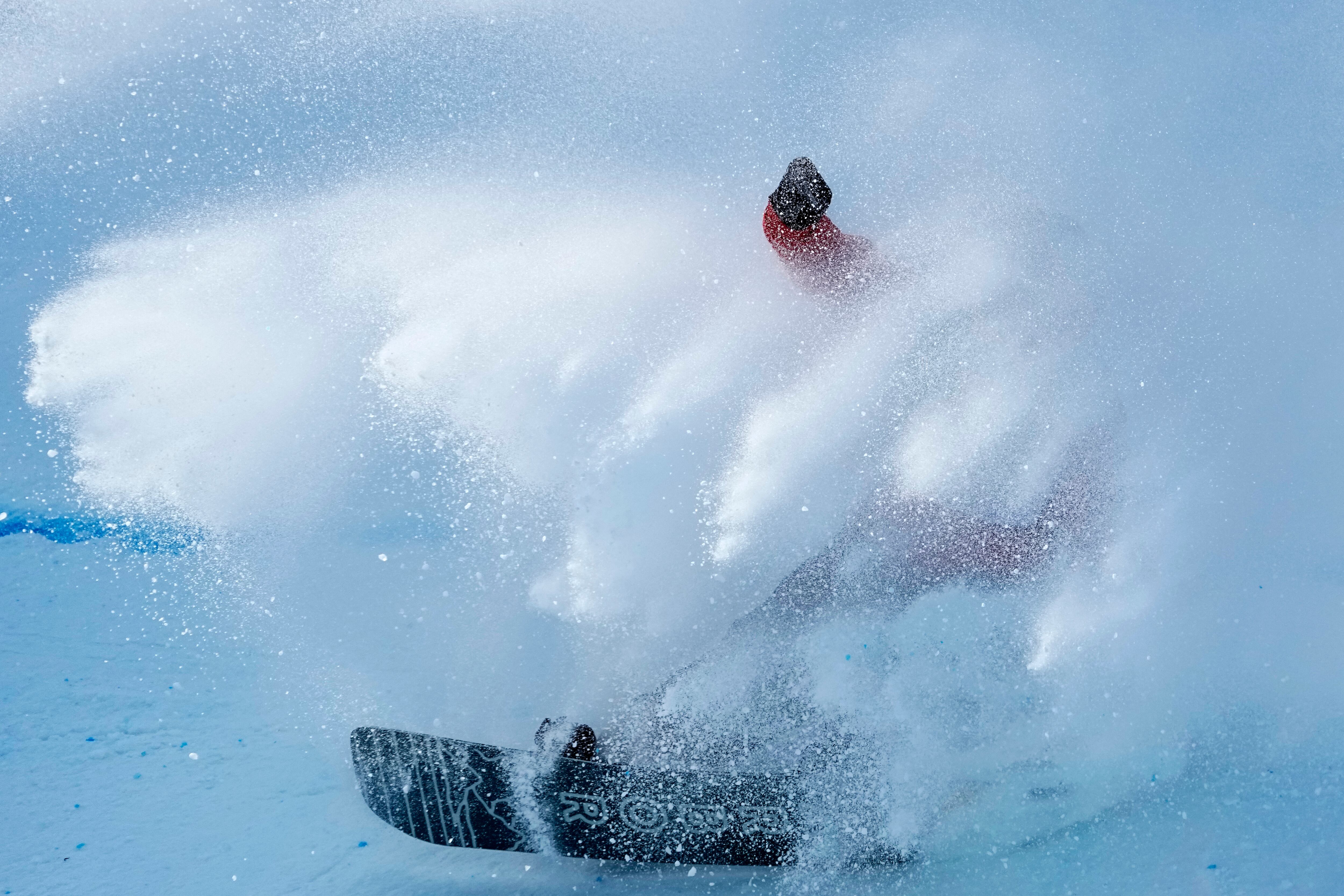 Niek van der Velden of the Netherlands crashes as he lads during his run during the men's snowboard big air finals of the 2022 Winter Olympics, Feb. 15, 2022, in Beijing.