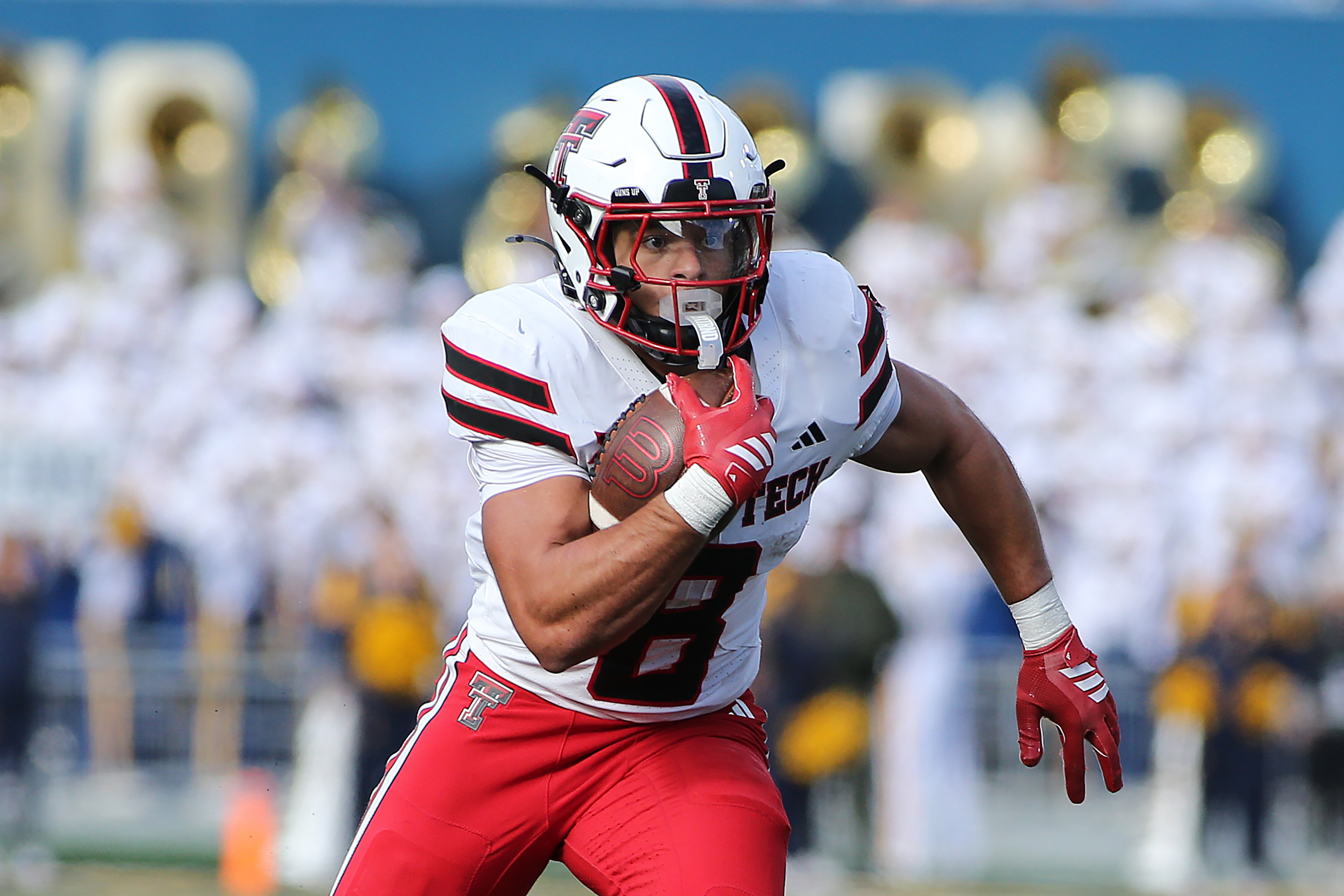 Texas Tech running back Cameron Dickey (8) runs against West Virginia during the first half of an NCAA college football game Saturday, Nov. 29, 2025, in Morgantown, W.Va. 