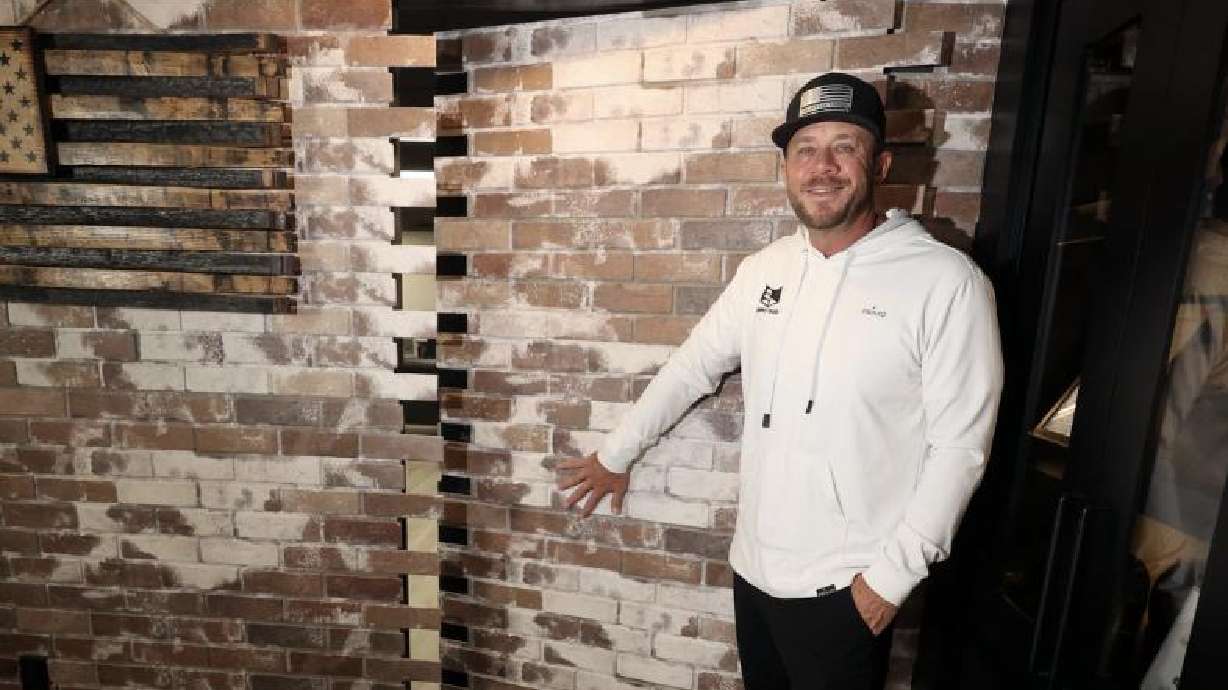 Jeremy Barker, Murphy Door founder and CEO, shows a secret door at Murphy Door in Ogden on Oct. 21.