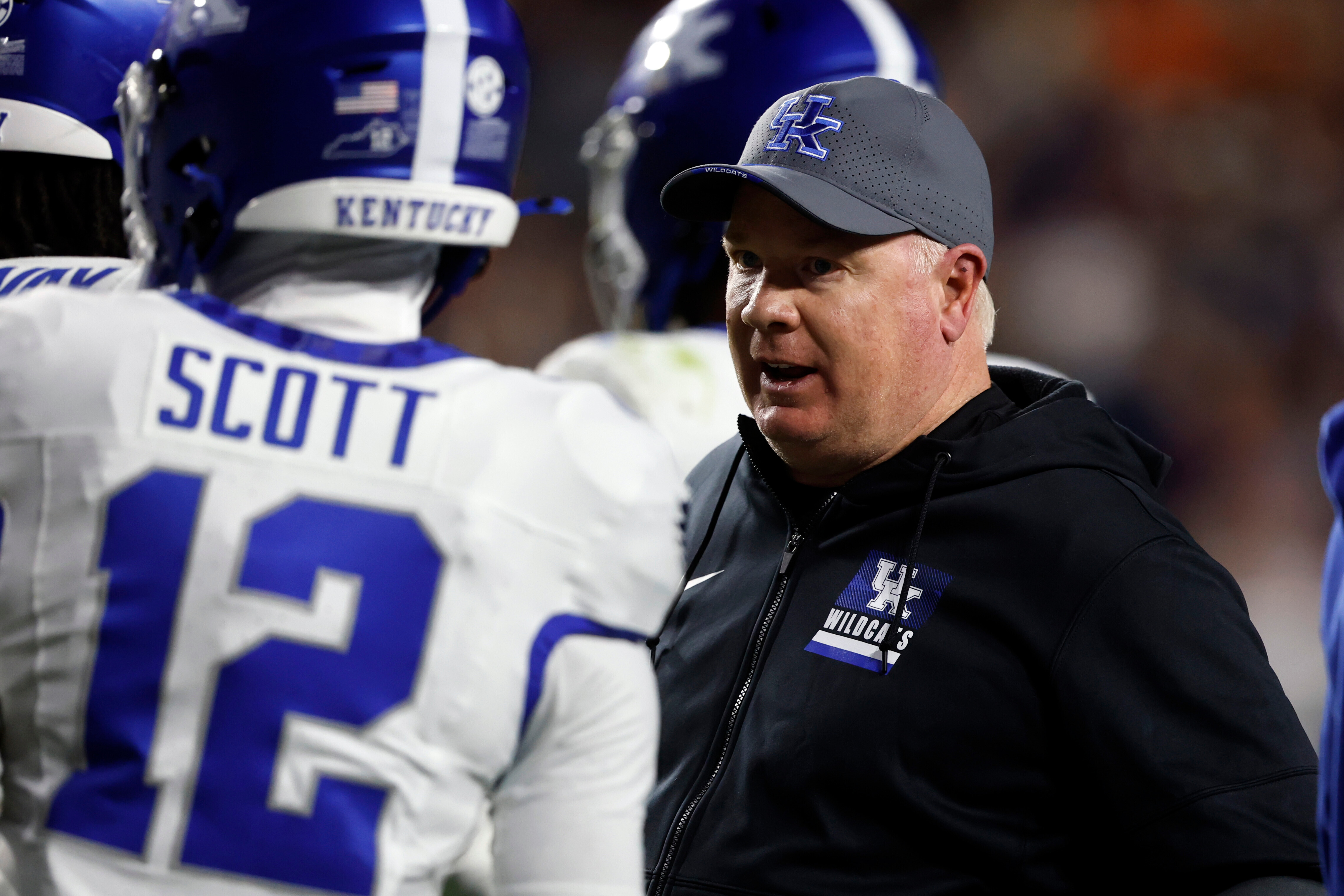 Kentucky head coach Mark Stoops talks with players during a timeout in the first half of an NCAA college football game against Auburn, Saturday, Nov. 1, 2025, in Auburn, Ala. 