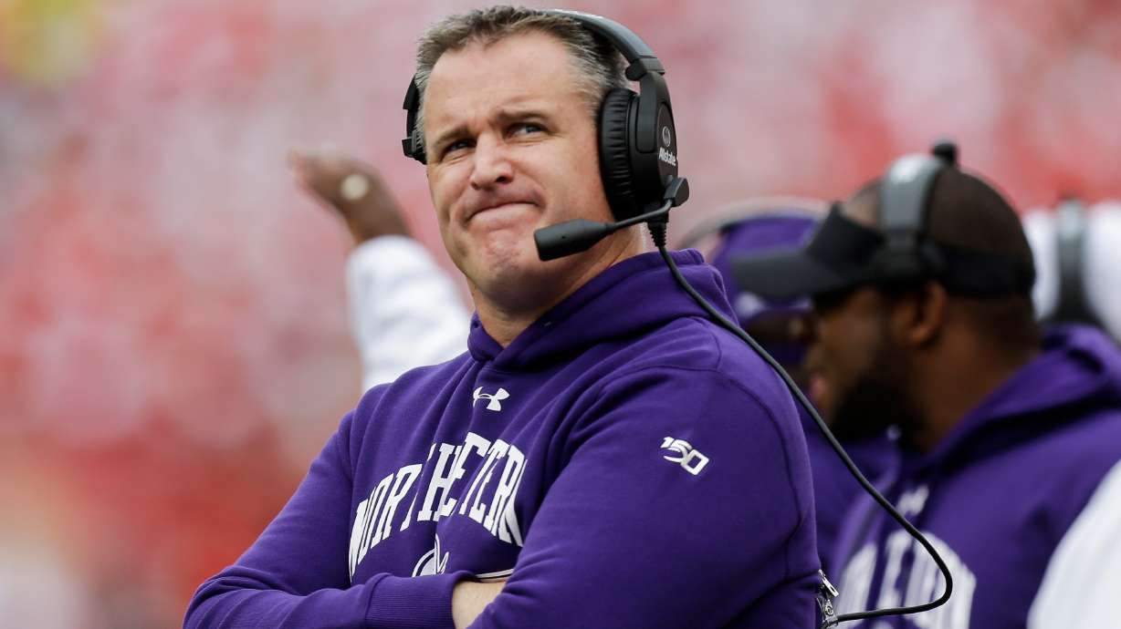 FILE - Northwestern head coach Pat Fitzgerald looks up on the sideline during the first half of an NCAA college football game against Wisconsin Saturday, Sept. 28, 2019, in Madison, Wis.