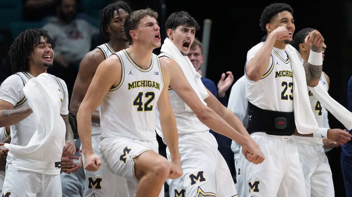 Michigan celebrates as they defeat Gonzaga in an NCAA college basketball game in the Players Era tournament in Las Vegas, Wednesday, Nov. 26, 2025.