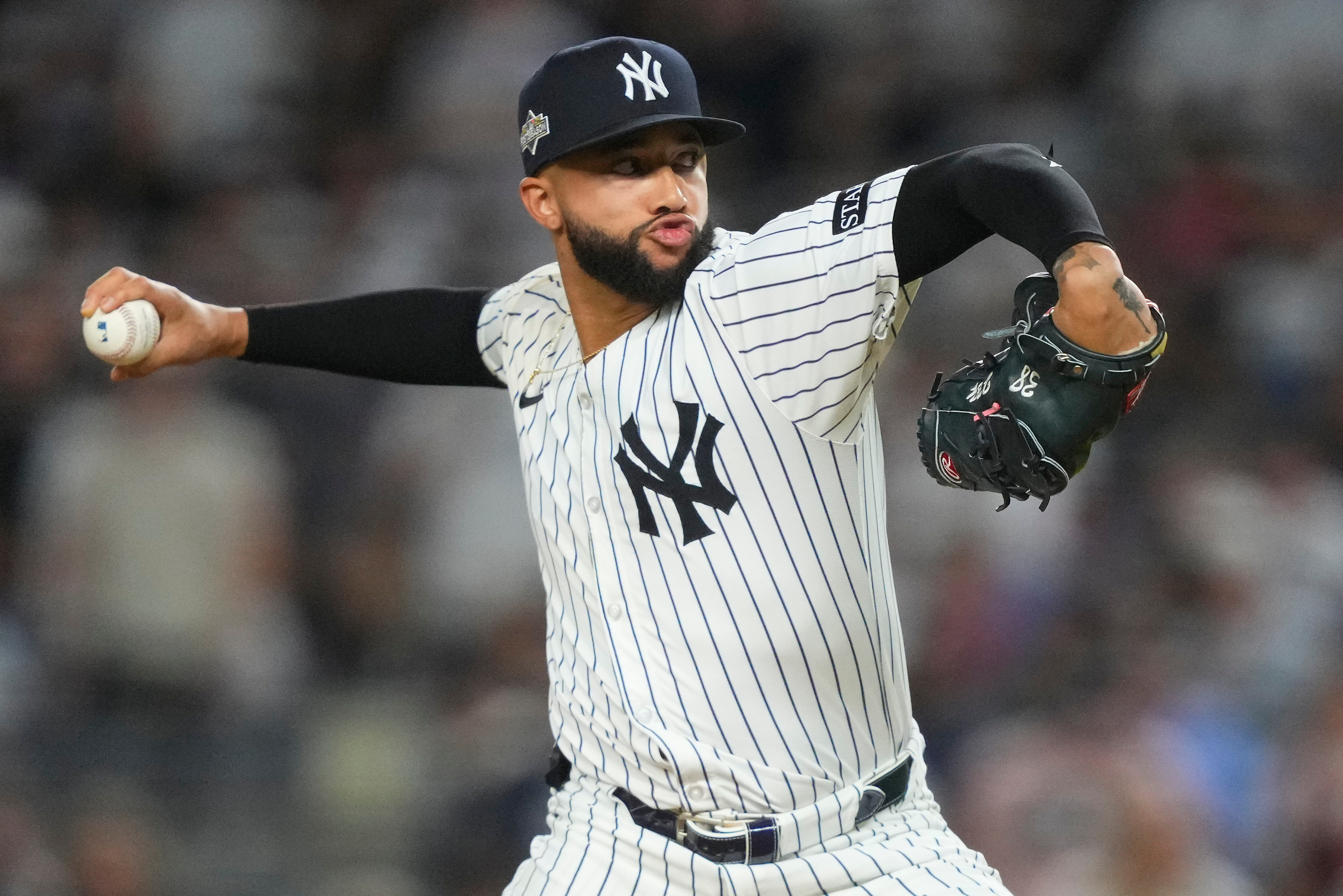 FILE - New York Yankees pitcher Devin Williams delivers against the Toronto Blue Jays during the seventh inning of Game 3 of baseball's American League Division Series, Oct. 7, 2025, in New York.