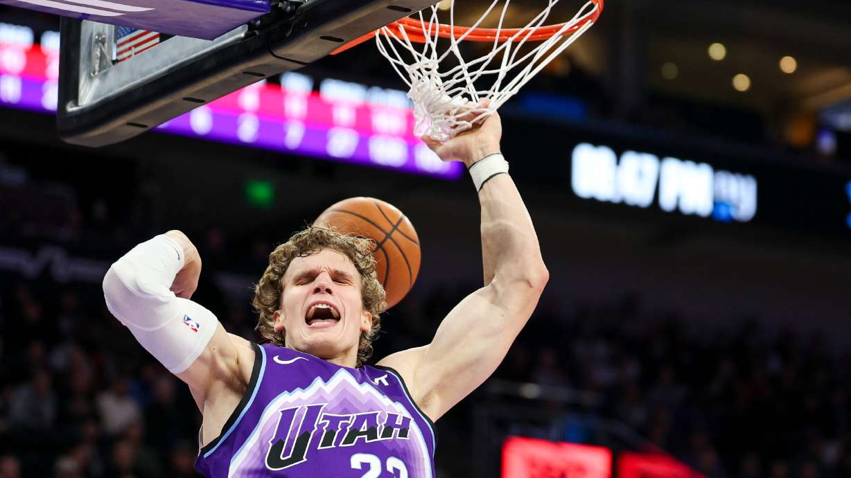 Utah Jazz forward Lauri Markkanen (23) reacts after being found while driving to the basket during the second half of an NBA game against the Houston Rockets at the Delta Center in Salt Lake City on Monday, Dec. 1, 2025.