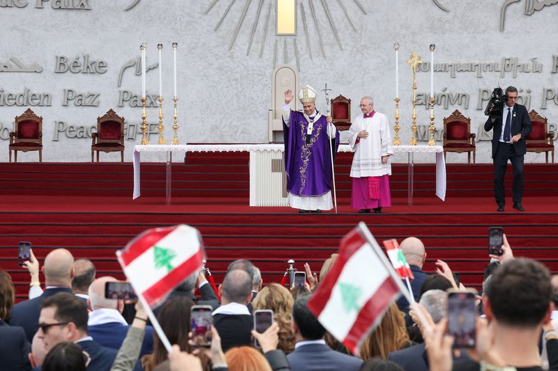 Pope Leo XIV waves to the crowd during a Holy Mass at the Waterfront, during his first apostolic journey, in Beirut, Lebanon, Tuesday.
