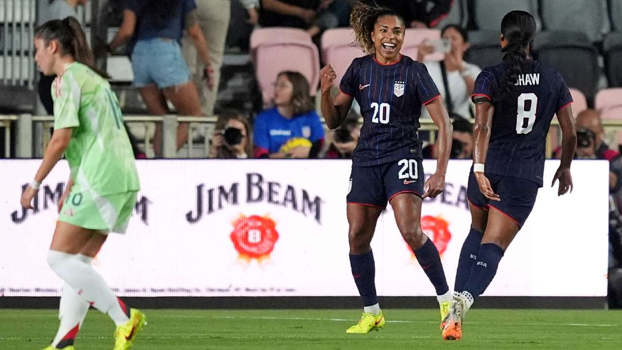 United States forward Catarina Macario (20) celebrates after scoring her side's first goal against Italy during the first half of an international friendly soccer match, Monday, Dec. 1, 2025, in Fort Lauderdale, Fla.