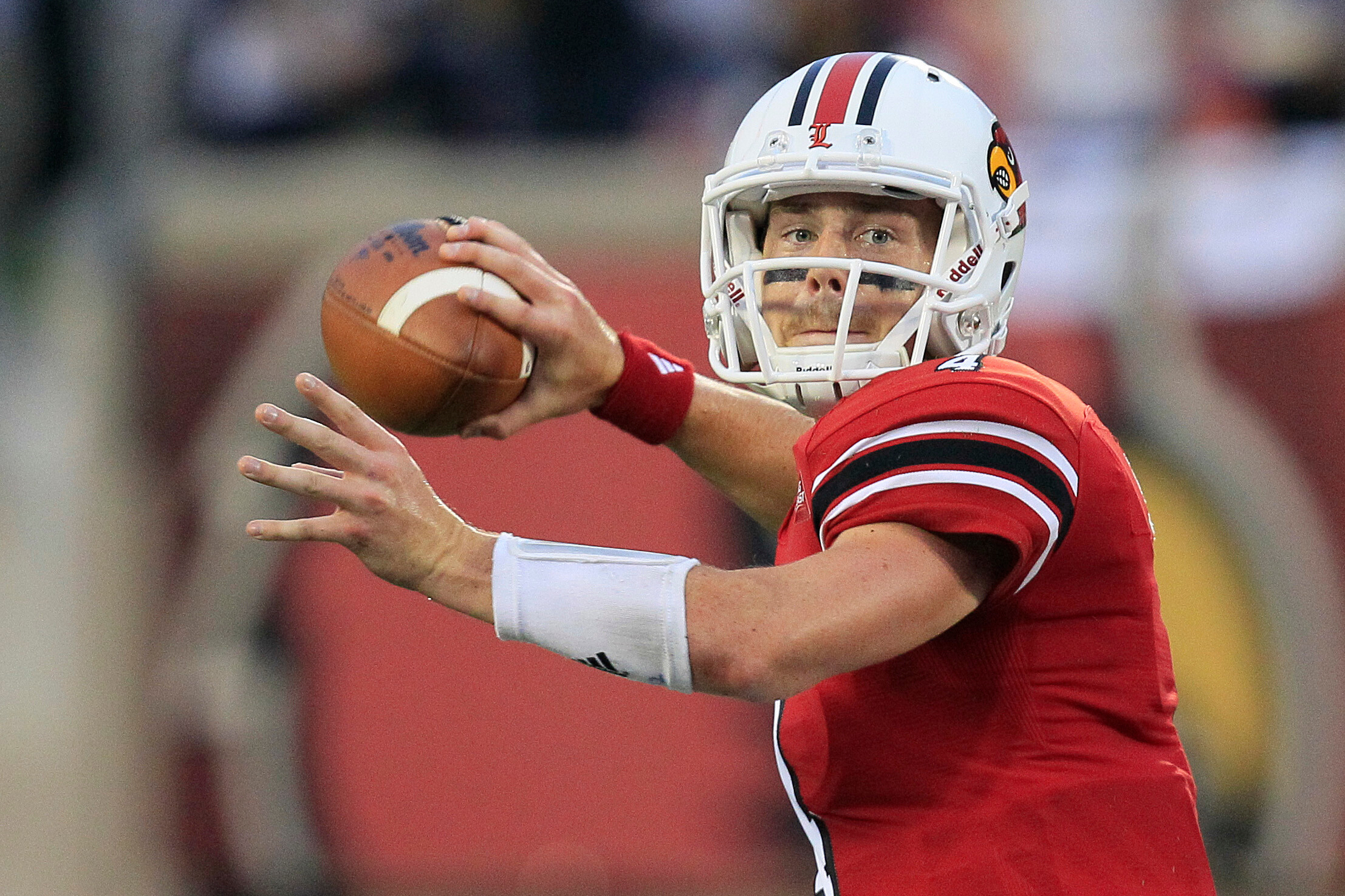 FILE - Louisville quarterback Will Stein readies a pass during the first half of their NCAA college football game against Florida International, Sept. 9, 2011, in Louisville, Ky. 