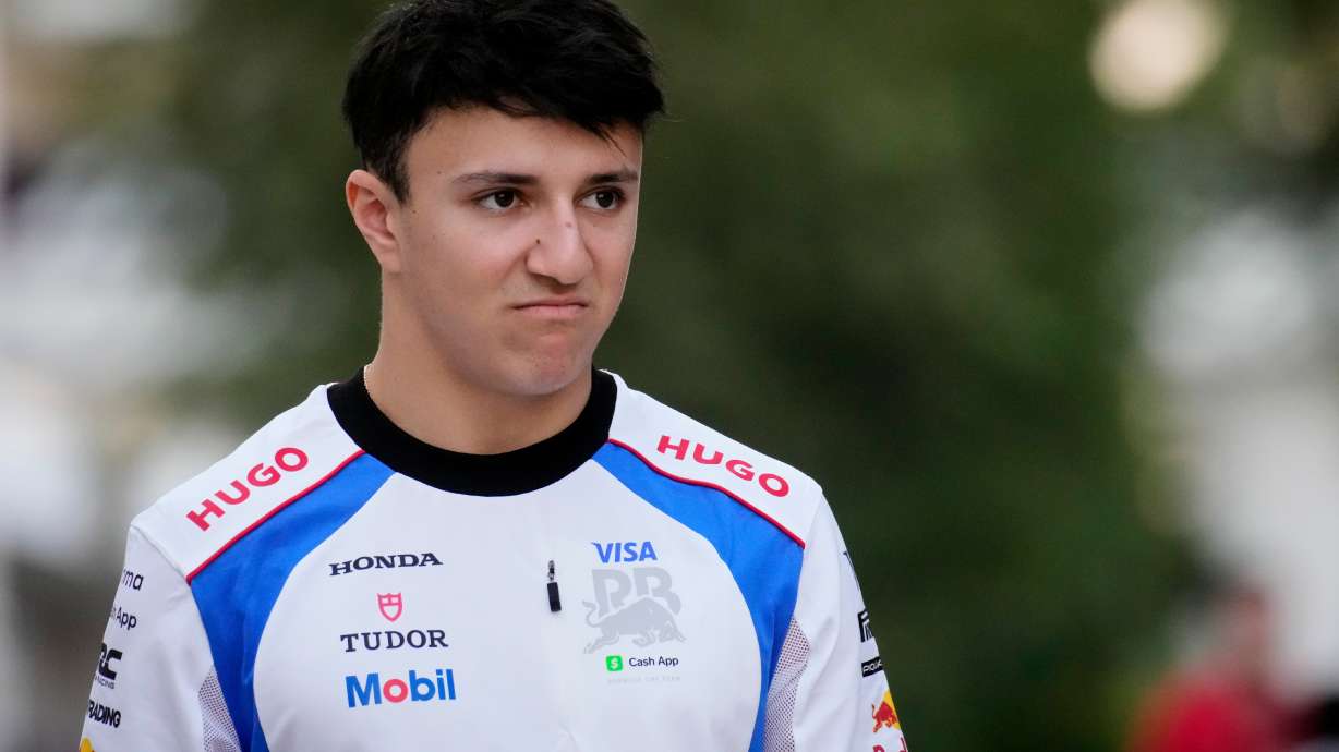 Racing Bulls driver Isack Hadjar of France walks through the paddock at the Lusail International Circuit ahead of the Qatar Formula One Grand Prix, in Lusail, Qatar, Thursday, Nov. 27, 2025.