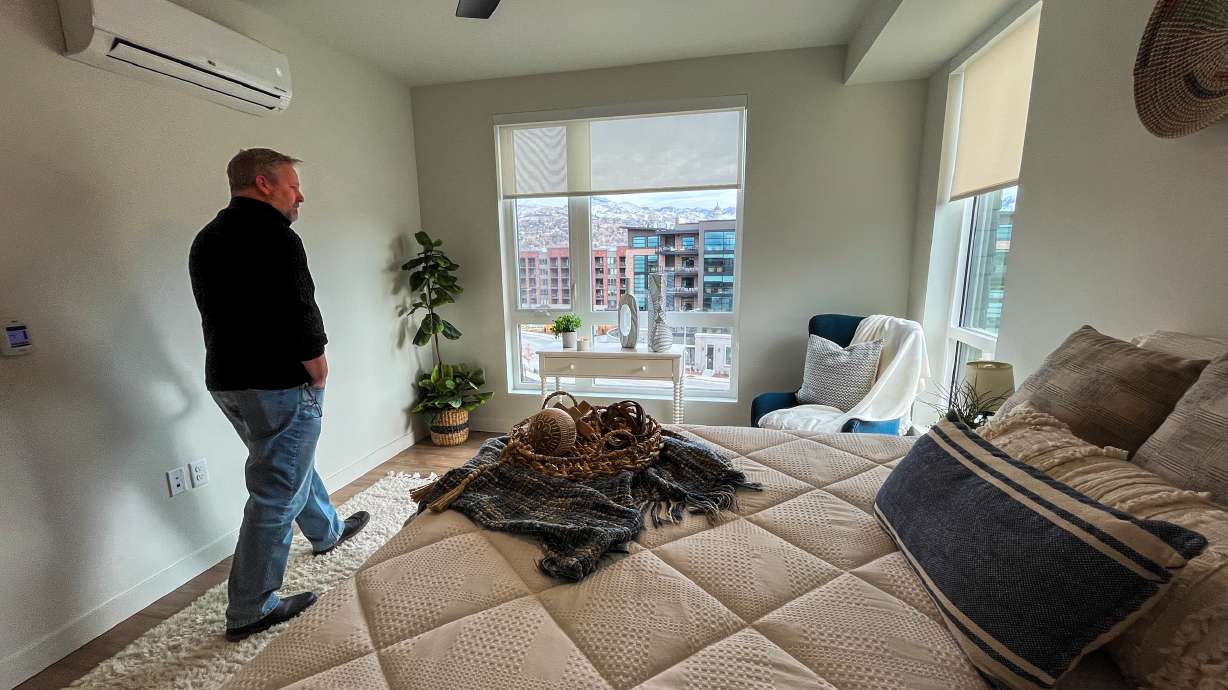 People explore one of the four bedrooms inside one of the 80 new affordable housing units at Citizens West's expansion after a ribbon-cutting ceremony in Salt Lake City on Tuesday. The project builds on the complex that first opened in 2021.