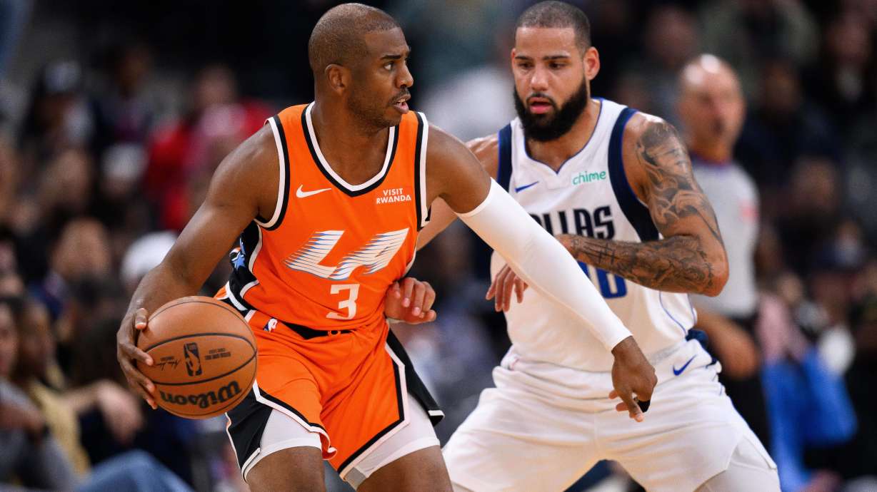 Los Angeles Clippers guard Chris Paul (3) controls the ball under pressure from Dallas Mavericks forward Caleb Martin during the first half of an NBA basketball game Saturday, Nov. 29, 2025, in Inglewood, Calif.