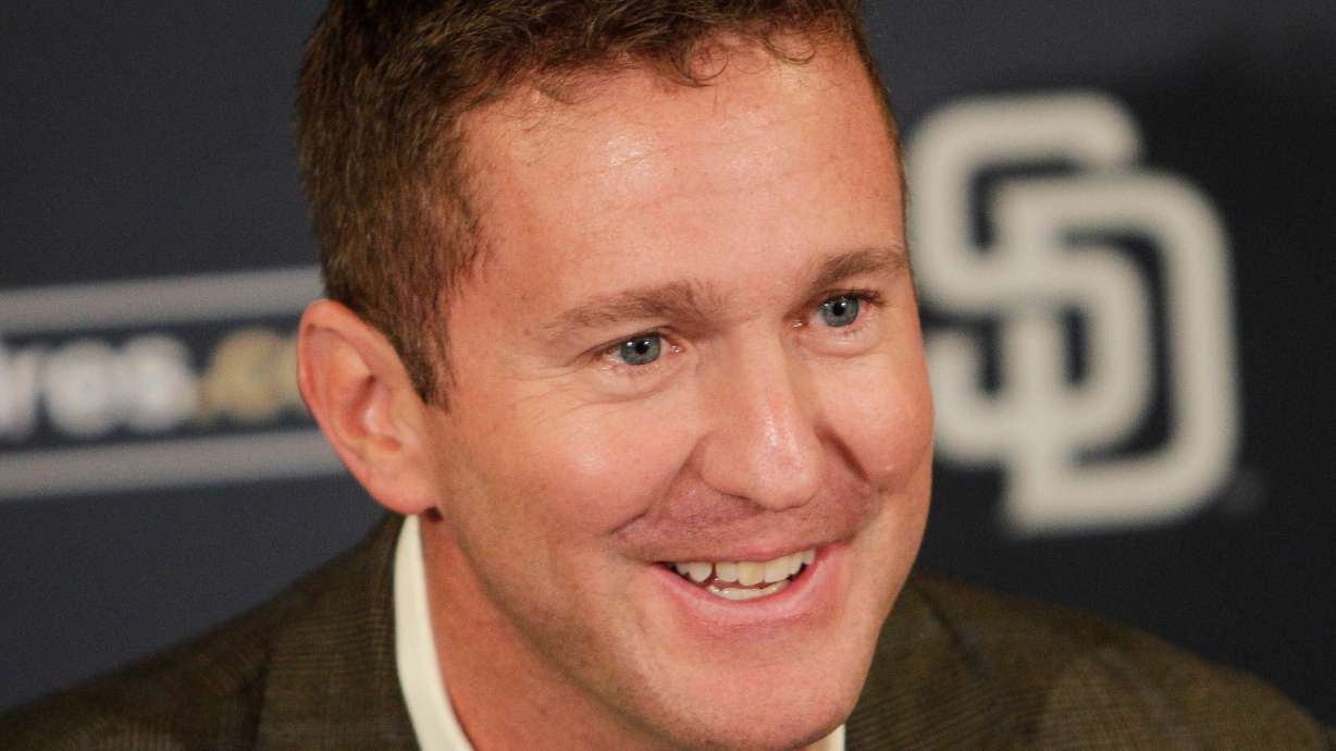 FILE - San Diego Padres general manager Josh Byrnes smiles during a baseball news conference Monday, Oct. 31, 2011 in San Diego.