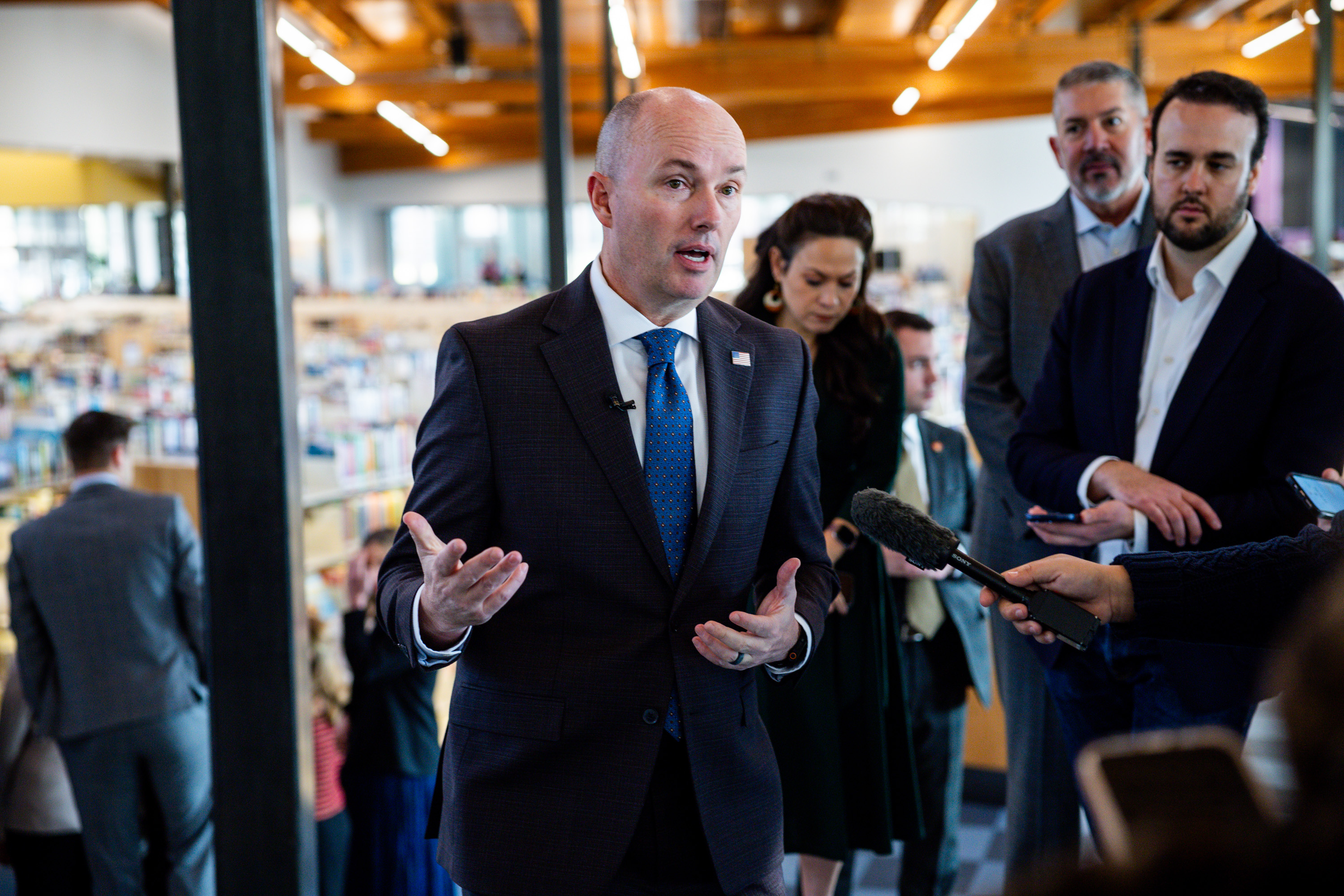 Gov. Spencer Cox speaks to reporters after speaking about the fiscal year 2026-27 budget rollout at a press conference at Kearns Library in Kearns on Wednesday.