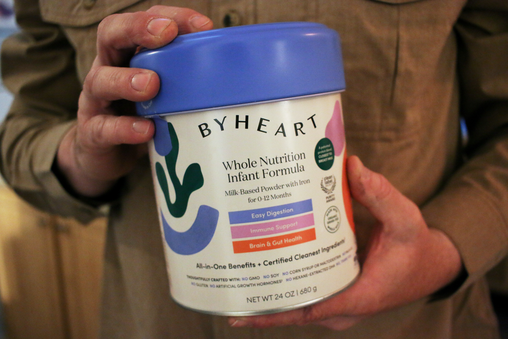Stephen Dexter holds a container of ByHeart baby formula, which was recently recalled by ByHeart, in Flagstaff, Ariz., on Nov. 12. Families have sued ByHeart for selling them contaminated formula.