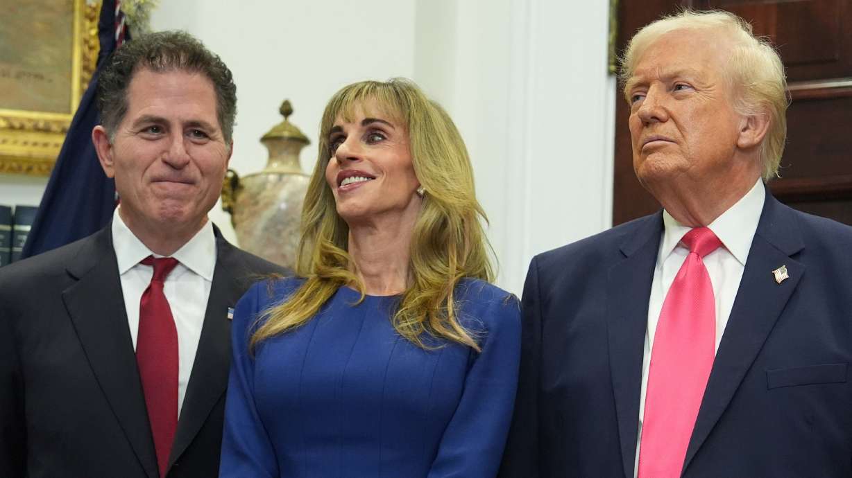 Michael Dell, his wife, Susan, and President Donald Trump listen during an event on "Trump Accounts" for kids in the Roosevelt Room of the White House, Tuesday, in Washington. Utah Rep. Blake Moore originally proposed the program.