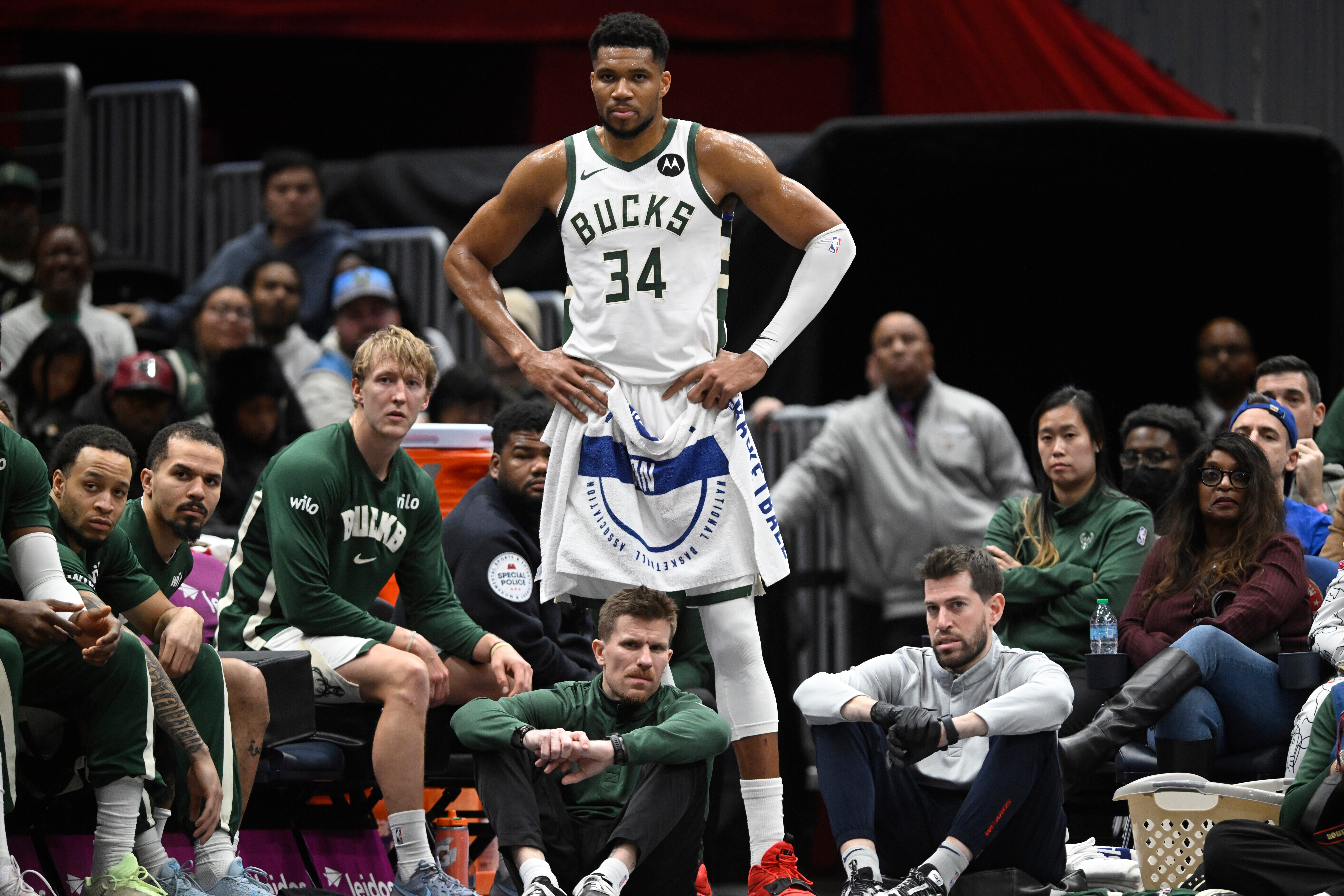 Milwaukee Bucks forward Giannis Antetokounmpo (34) watches the action while resting during the second half of an NBA basketball game against the Washington Wizards, Monday, Dec. 1, 2025, in Washington.