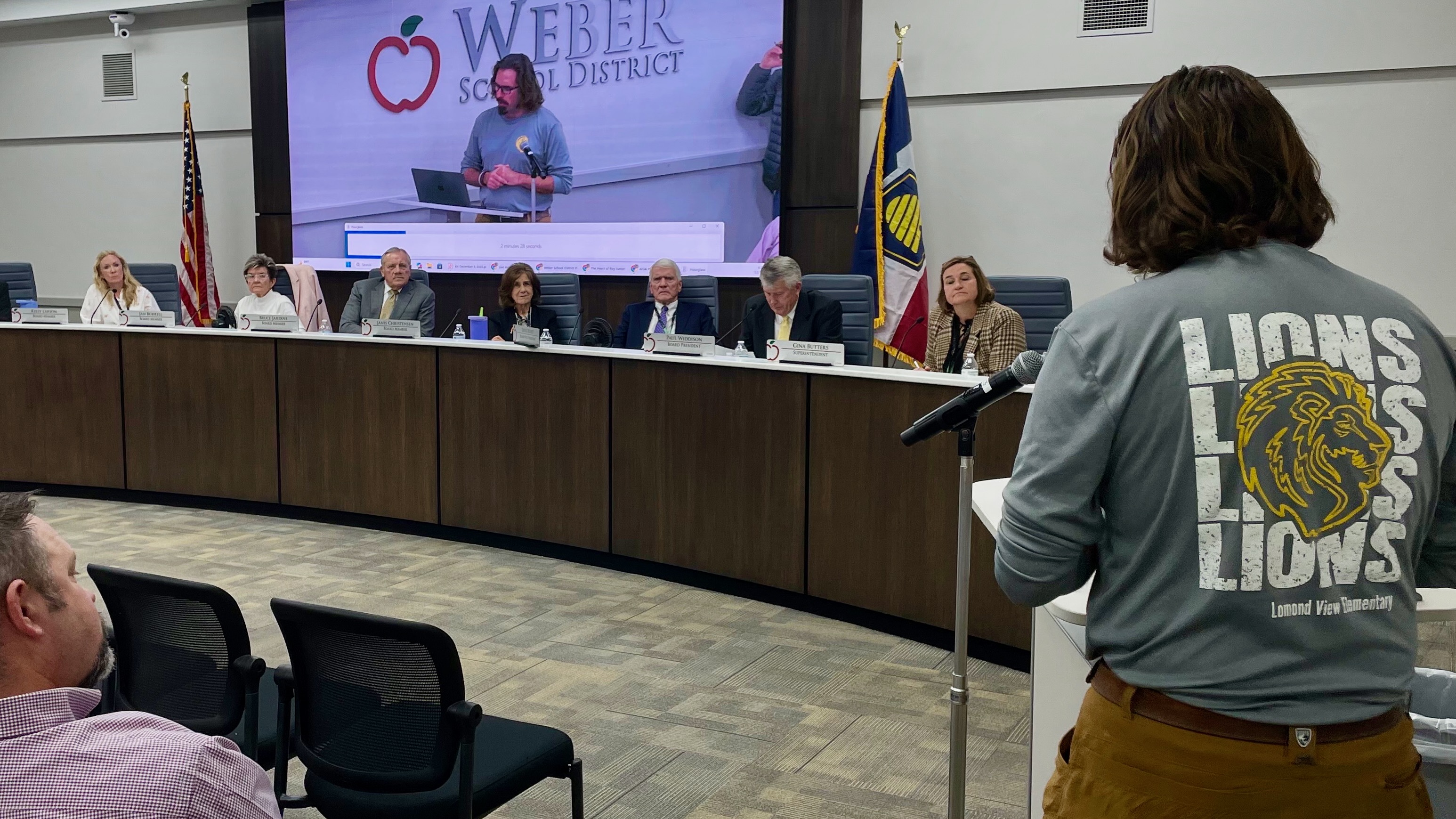 Weber School District officials voted Wednesday to keep Lomond View Elementary in Pleasant View open. Parent Chad Hill, right, addresses school officials on the issue at the meeting, held at the main district offices in Washington Terrace.
