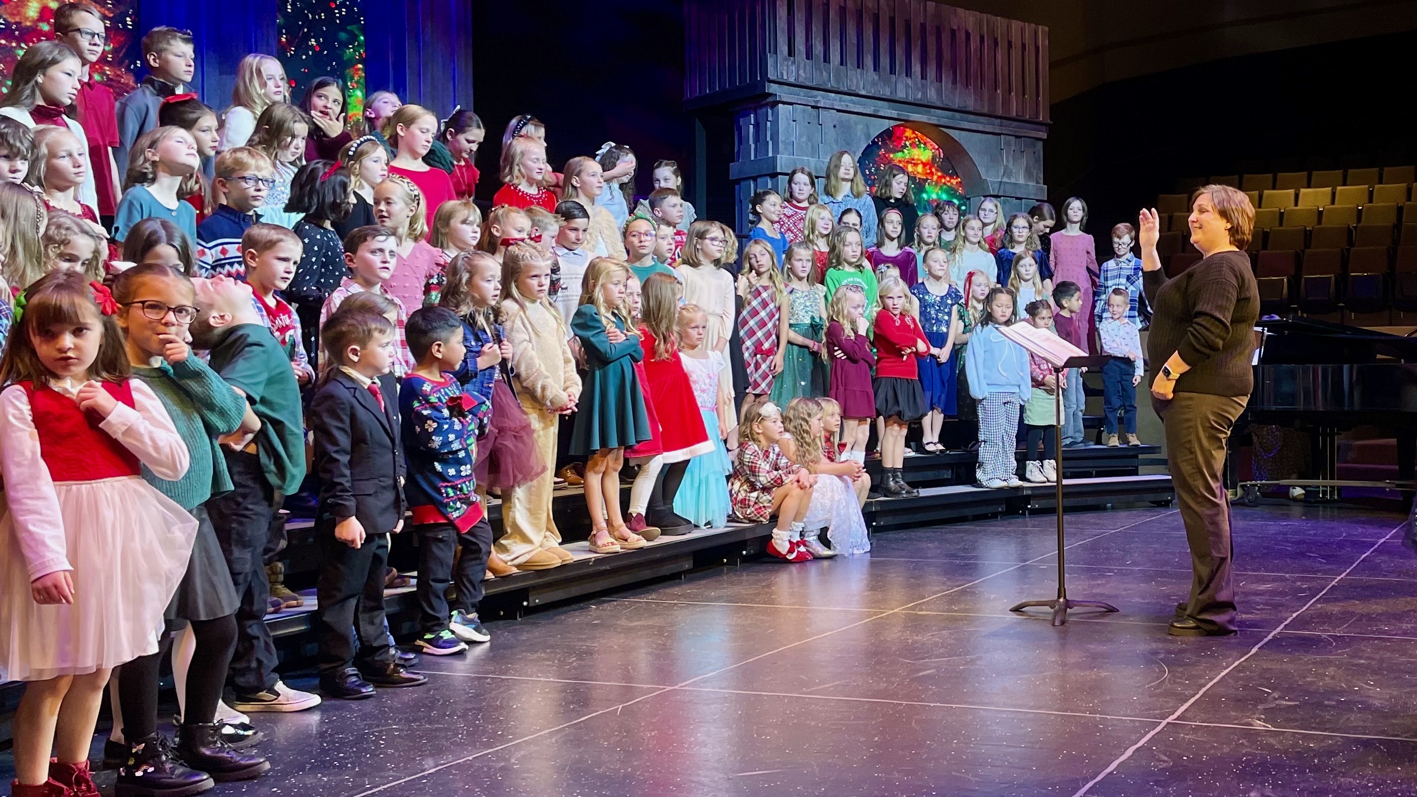 Becca Hoxer directs the Bates Elementary choir at her final concert with the group on Wednesday at Weber High School in Pleasant View. She plans to now turn her focus to family and fighting cancer.