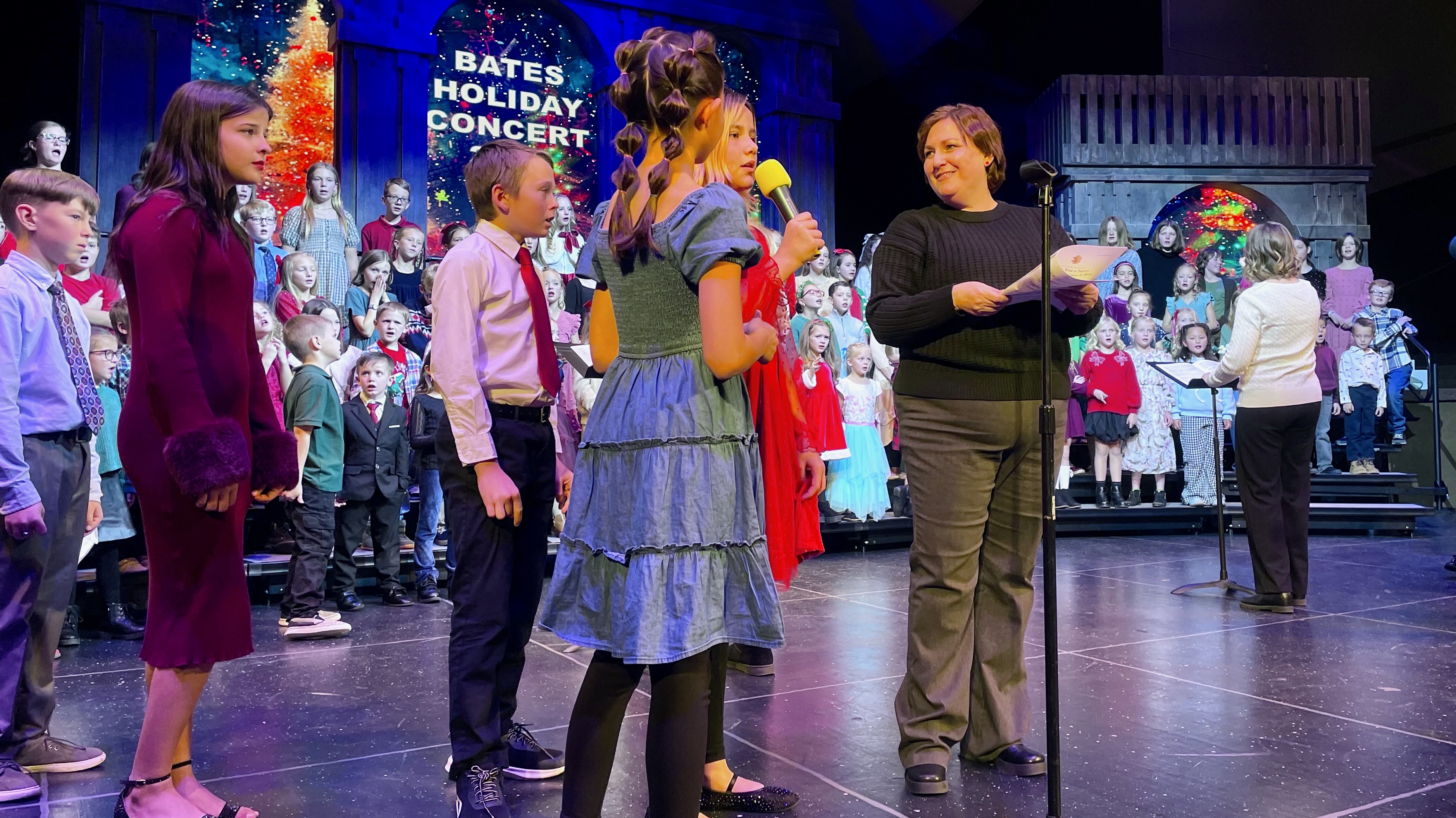 Becca Hoxer helps lead the Bates Elementary choir at her final concert with the group on Wednesday at Weber High School in Pleasant View. She plans to now turn her focus to family and fighting cancer.