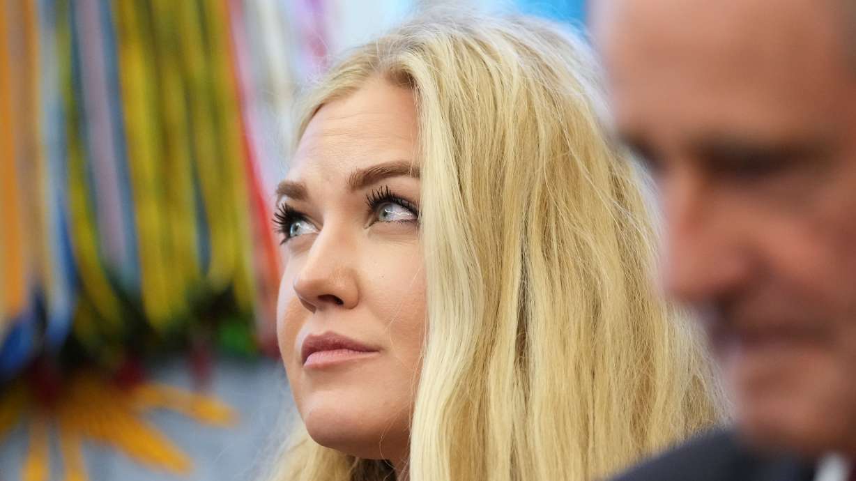 Erika Kirk listens as President Donald Trump speaks in the Oval Office of the White House, Nov. 10, in Washington. Kirk called conspiracy theories about her husband's death "a mind virus" in an appearance on Fox News on Wednesday.